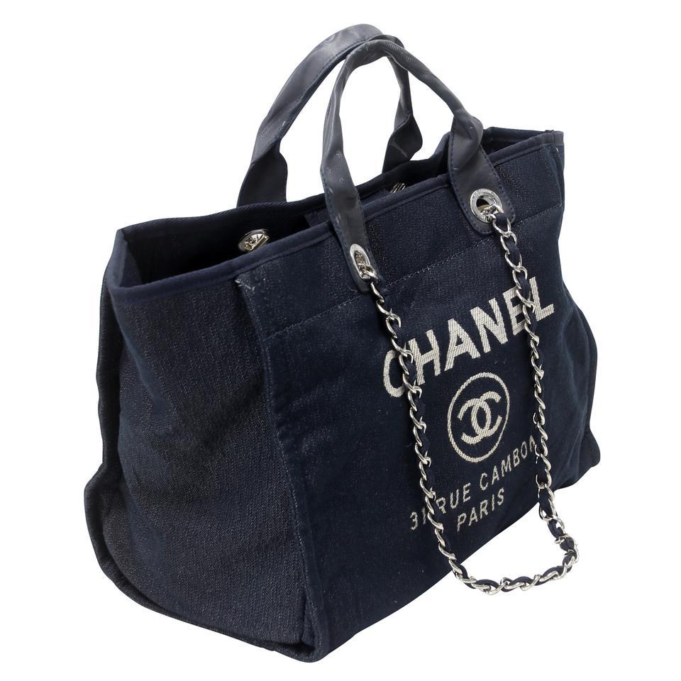 Here is a signature master piece by the world famous CHANEL with elegant Mixed Denim Fibers Deauville Tote denim travel bag. This stylish handbag is crafted of fine mixed fibers in blue with an embroidered Chanel Rue Cambon Paris logo and elegant