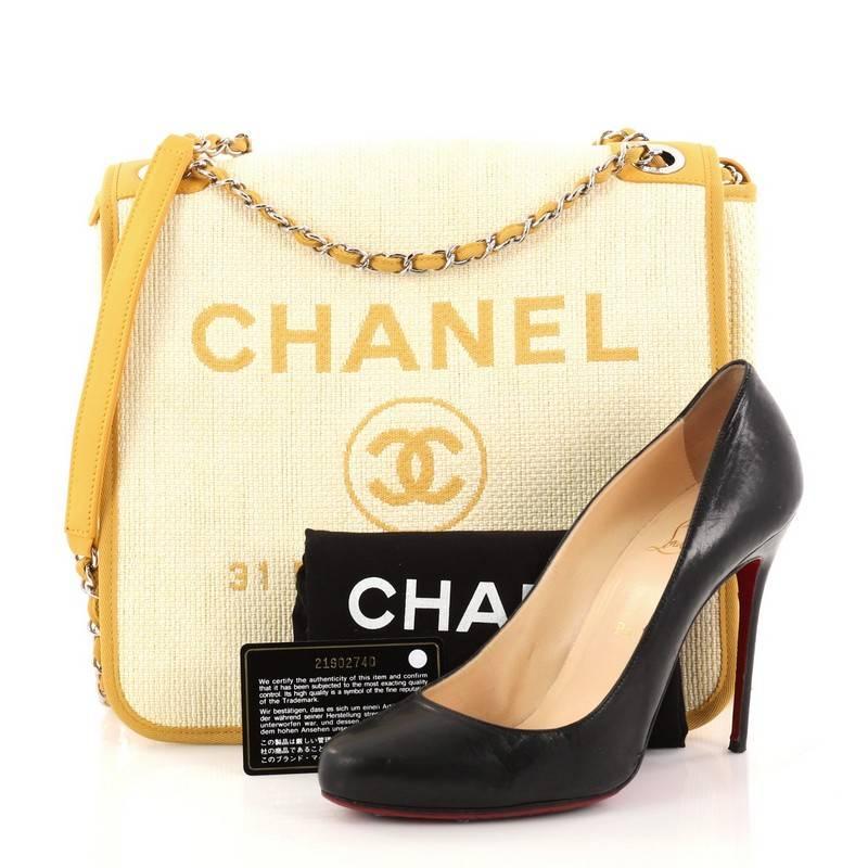This authentic Chanel Deauville Messenger Bag Canvas Small embodies a casual chic style made for any fashionista. Crafted in yellow canvas, this chic messenger bag features woven-in chain leather strap with shoulder pads, yellow fabric trims with