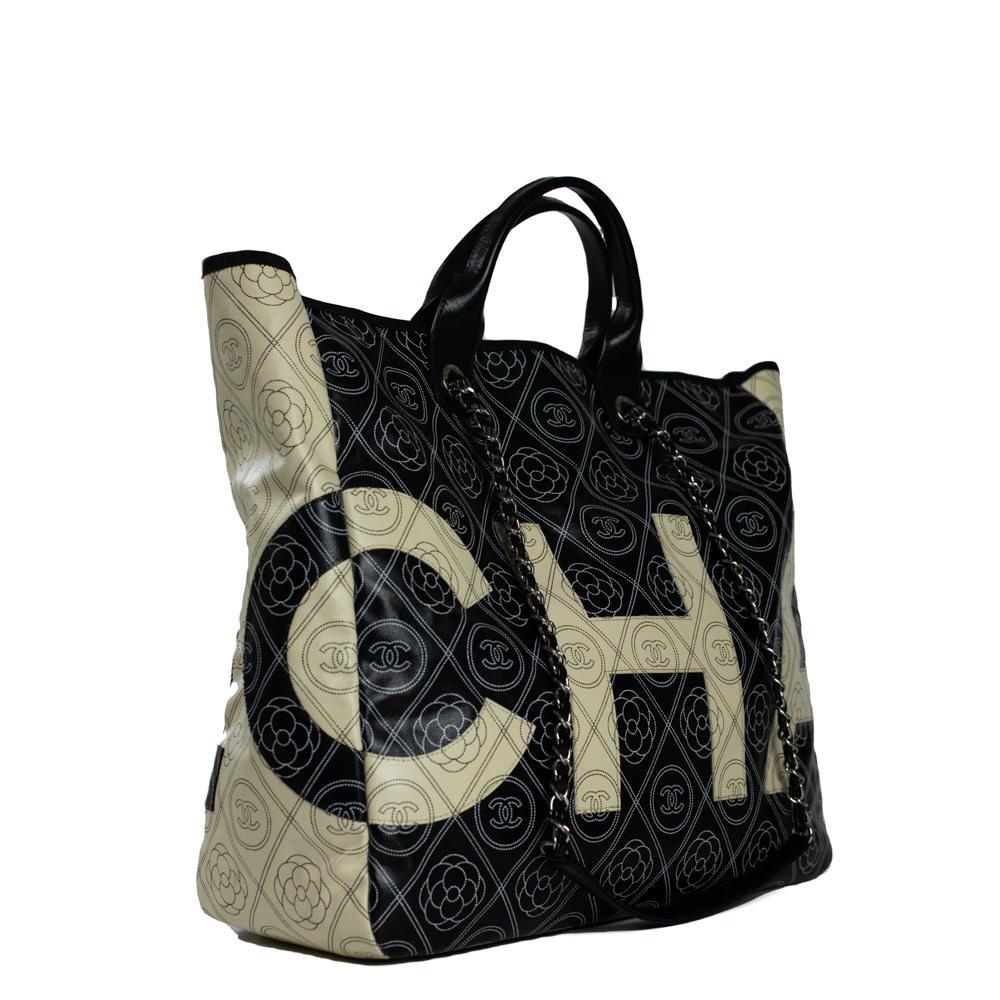 - Designer: CHANEL
- Model: Deauville
- Condition: Very good condition. Exterior stains
- Accessories: None
- Measurements: Width: 39cm , Height: 37cm , Depth: 14cm 
- Exterior Material: Canvas
- Exterior Color: Black
- Interior Material: Canvas
-