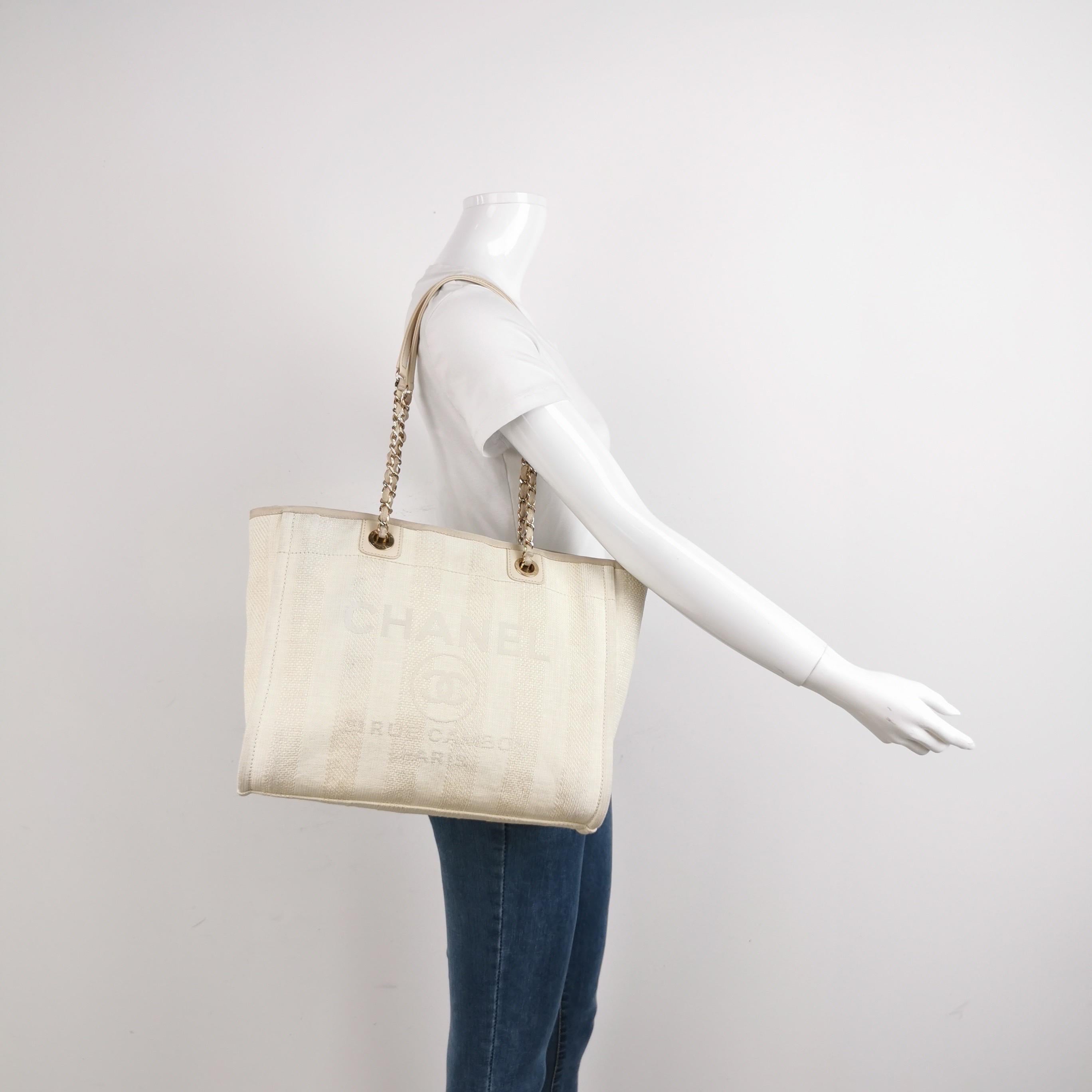 The Chanel Deauville Tote bag is a stylish accessory for everyday use. Crafted from durable denim, this tote is perfect for all season wear. Despite signs of use, this bag is in very good condition. Show off your effortless chic with the Chanel