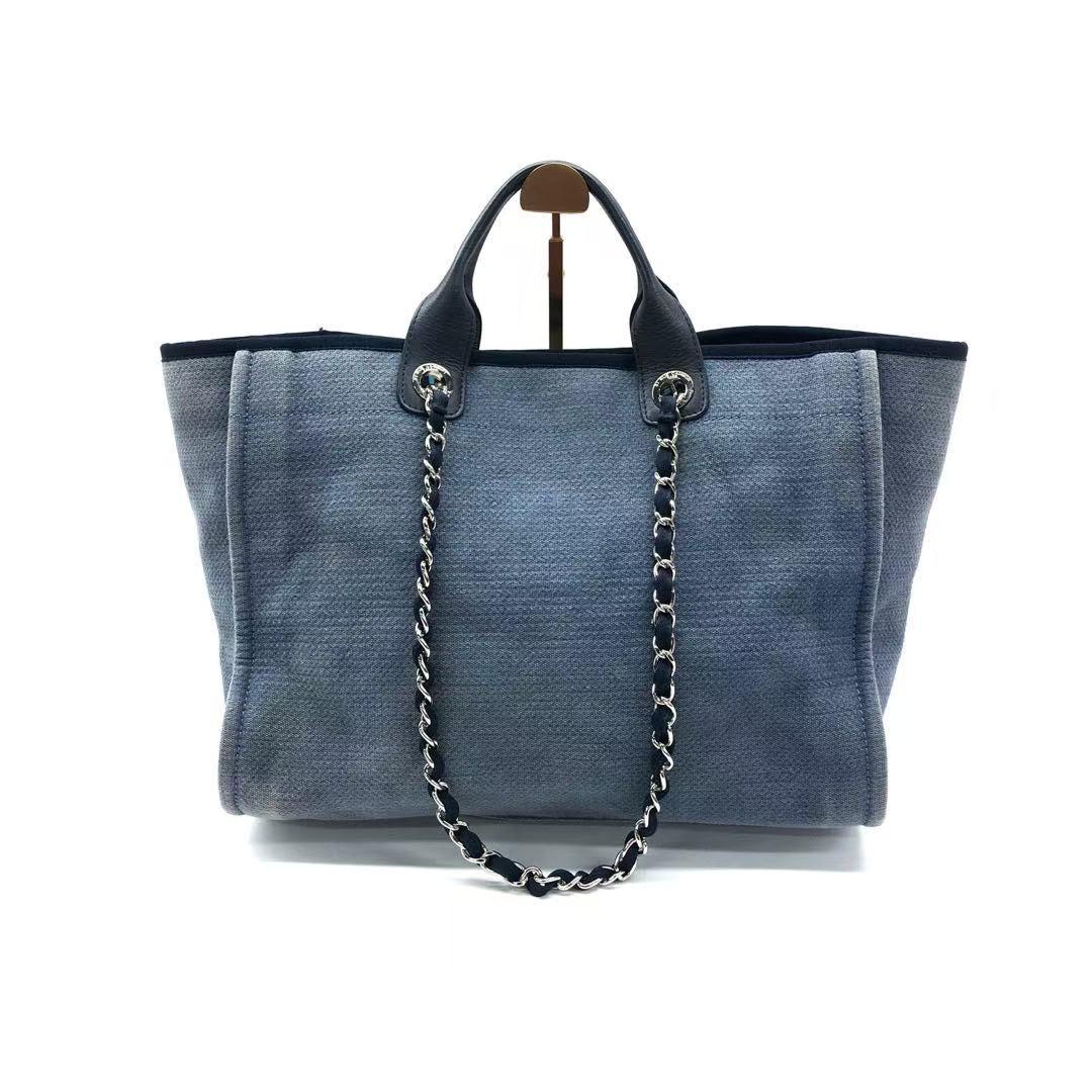 Chanel Deauville Tote Medium Navy Denim Top Handle 2012
 These are professional photos of the actual bag .
 The Chanel Deauville Tote, named after the French seaside resort, is a must-have for summer, combining elegance and functionality. Made of