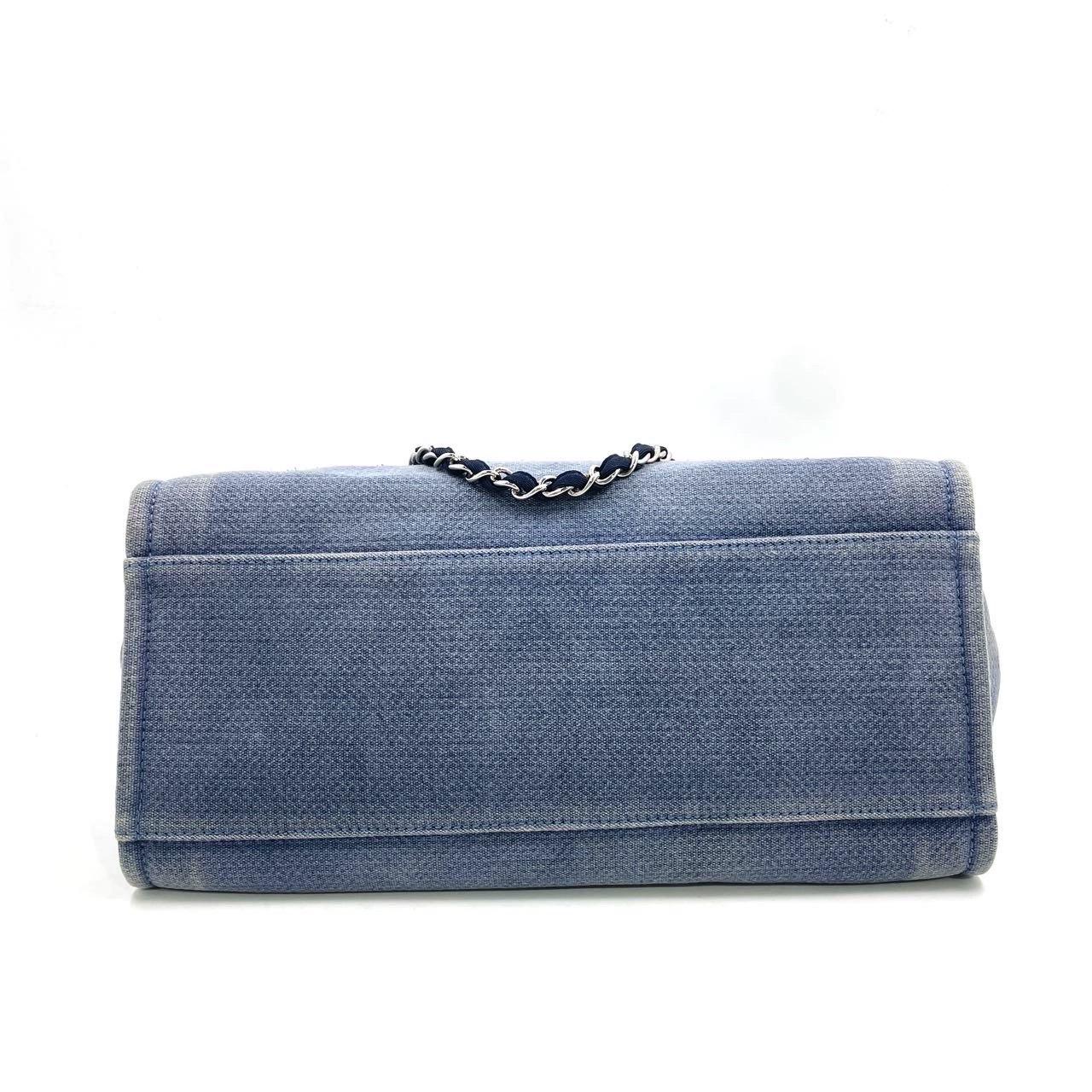Chanel Deauville Tote Medium Navy Denim Top Handle 2012
 These are professional photos of the actual bag .
 The Chanel Deauville Tote, named after the French seaside resort, is a must-have for summer, combining elegance and functionality. Made of