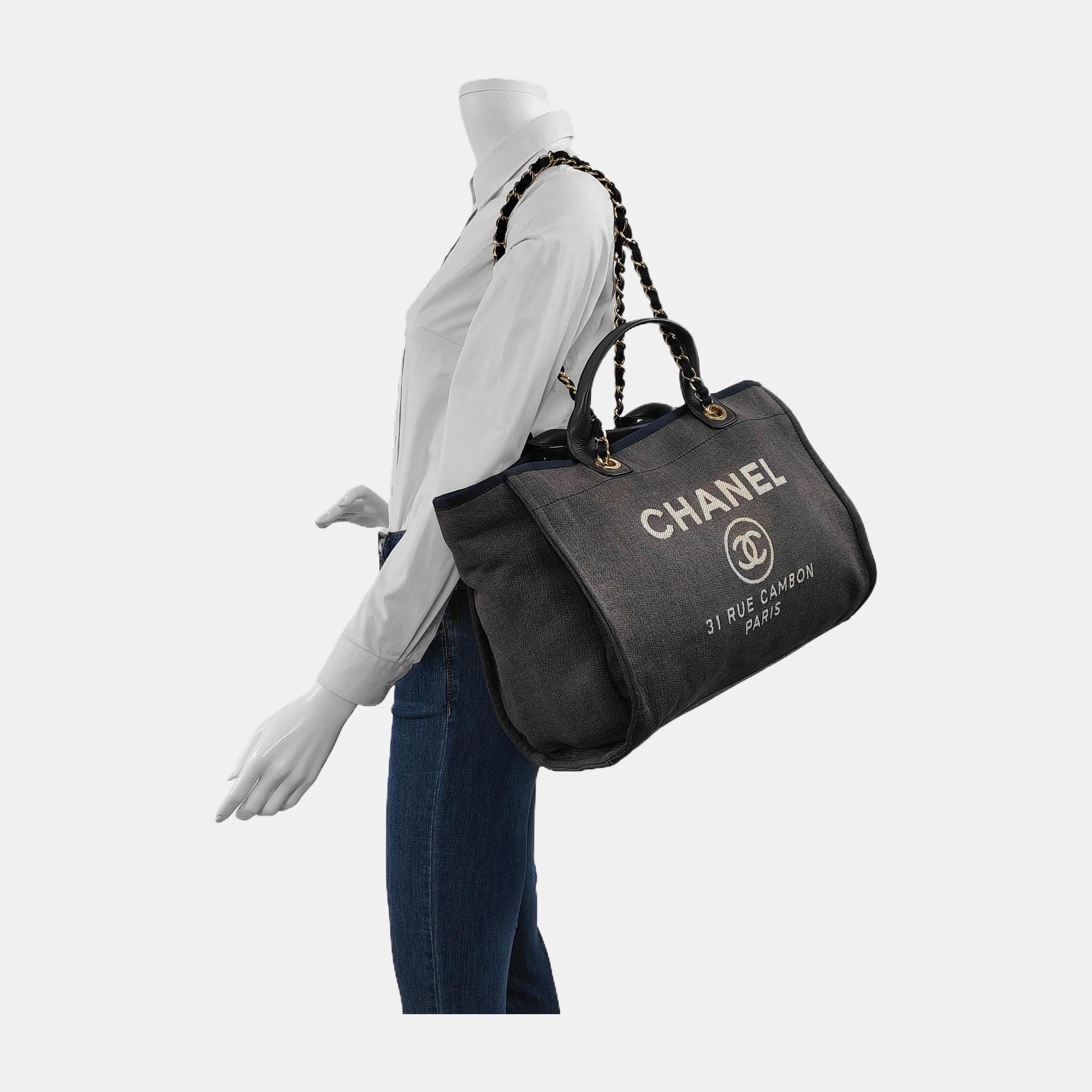 The Chanel Deauville Tote, named after the French seaside resort, is a must-have for summer, combining elegance and functionality. Made of lightweight denim-like material, it's perfect for carrying by hand or on the shoulder with the matelasse chain