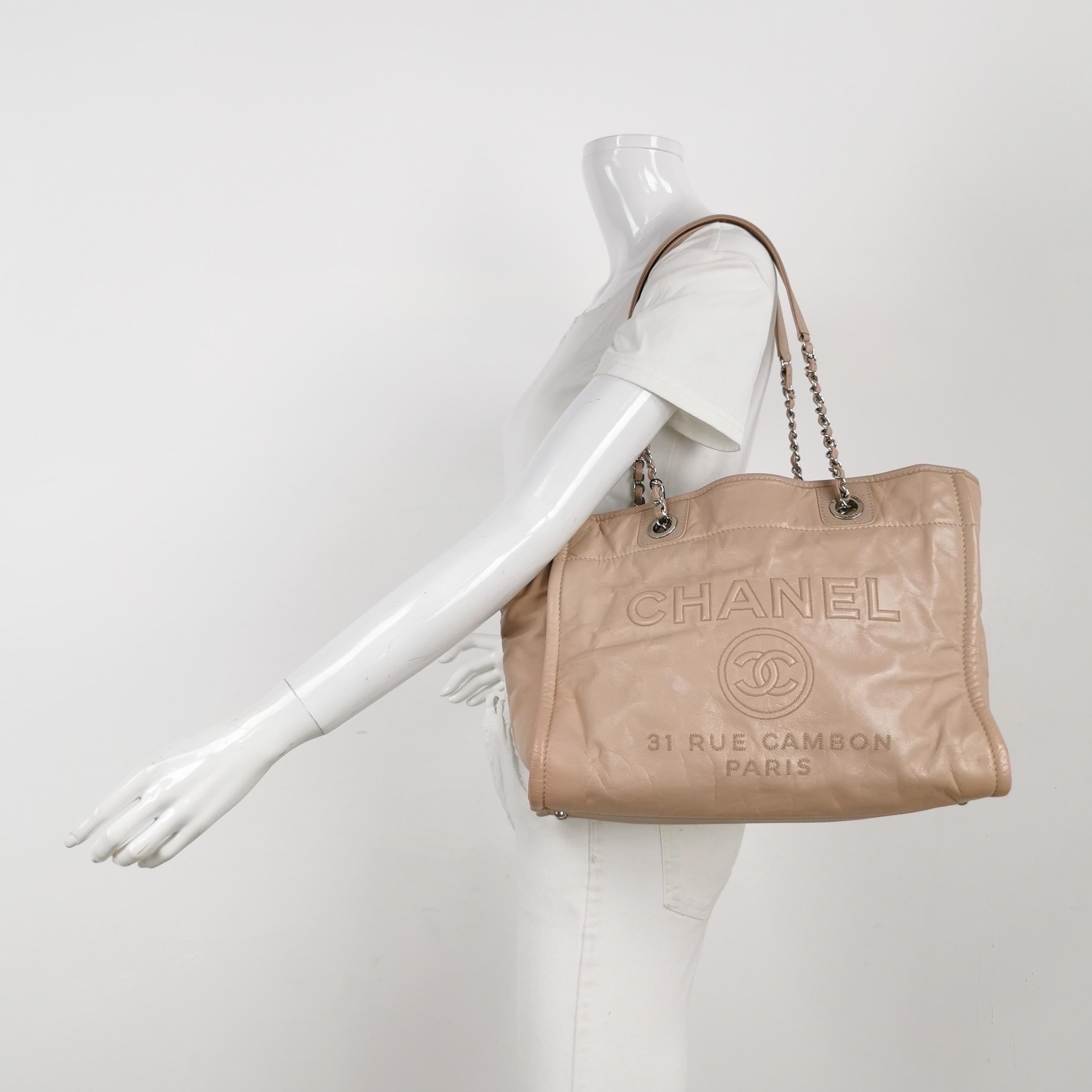 Chanel Deauville Tote Medium Pink Leather Leather Chain Straps
These are professional photos of the actual bag offered by Luxbags.
The Chanel Deauville Tote, named after the French seaside resort, is a must-have for summer, combining elegance and