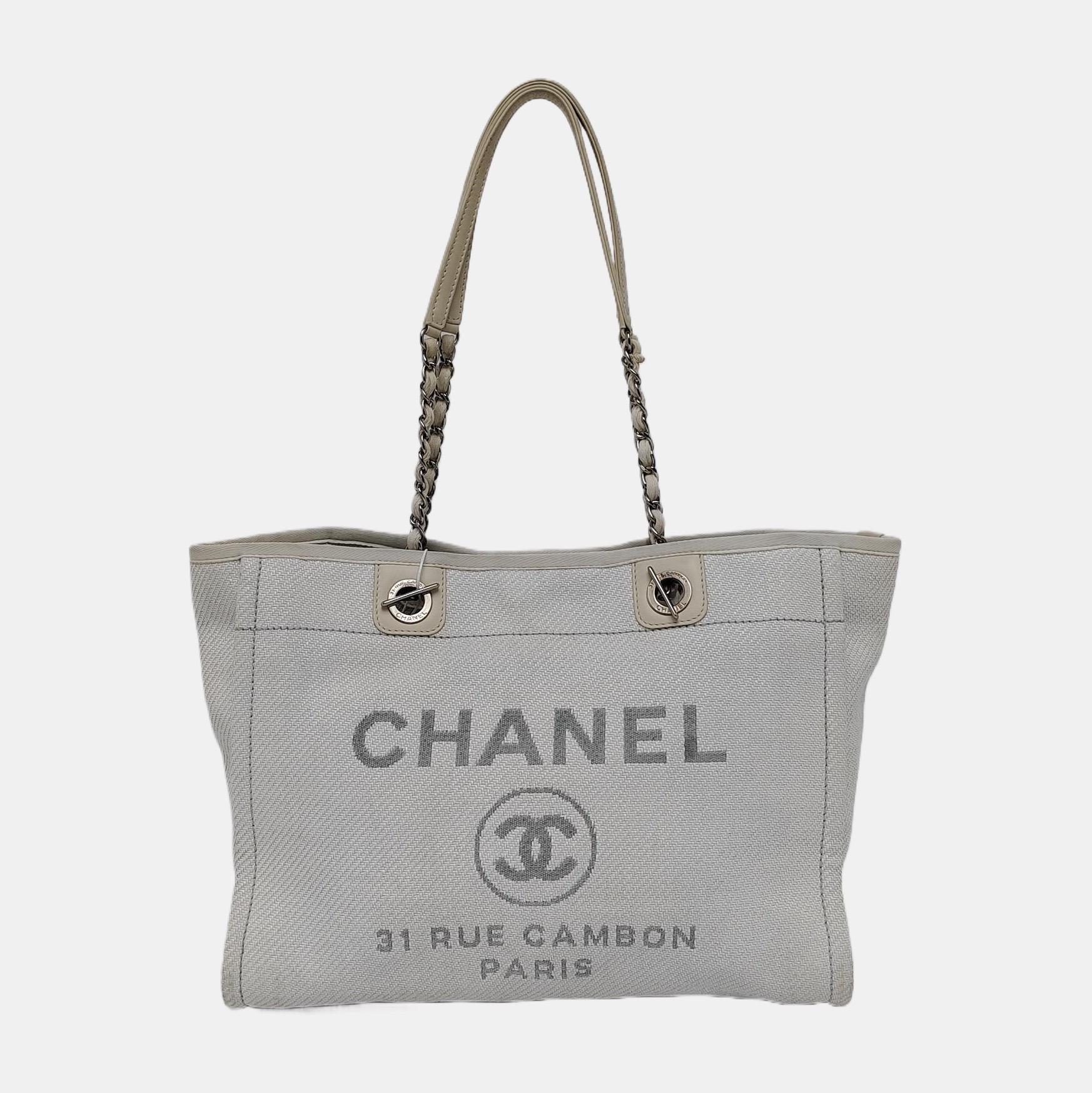 The Chanel Deauville Tote bag is a stylish accessory for everyday use. Crafted from durable denim, this tote is perfect for all season wear. Despite signs of use, this bag is in very good condition. Show off your effortless chic with the Chanel