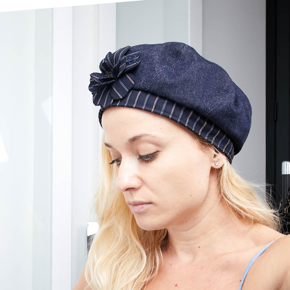 CHANEL Denim and Striped Camellia Beret Size 57 FR
A must. This beret is in blue denim with a camellia embroidered in shiny red and blue. 
In very good condition. 
There is a double C in metal on the camellia. It is lined in satin.
Made in