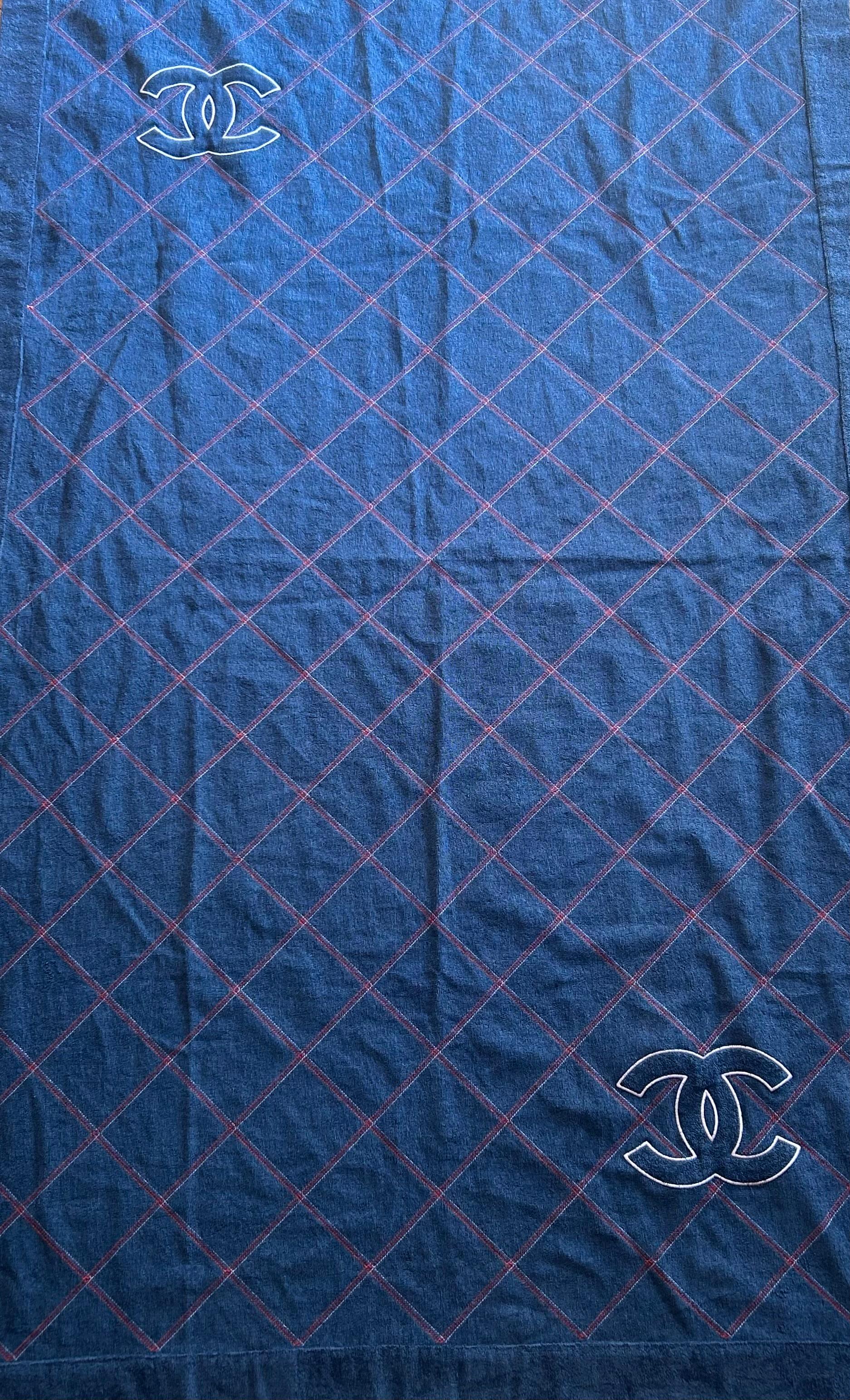 Chanel Denim Blue Towel. This beautiful towel, is in perfect condition, the squared patter in a perfect representation of the brand fascination with the diamond shape, as seen on most bags like the classic bag. The color is vibrant and bold, and the