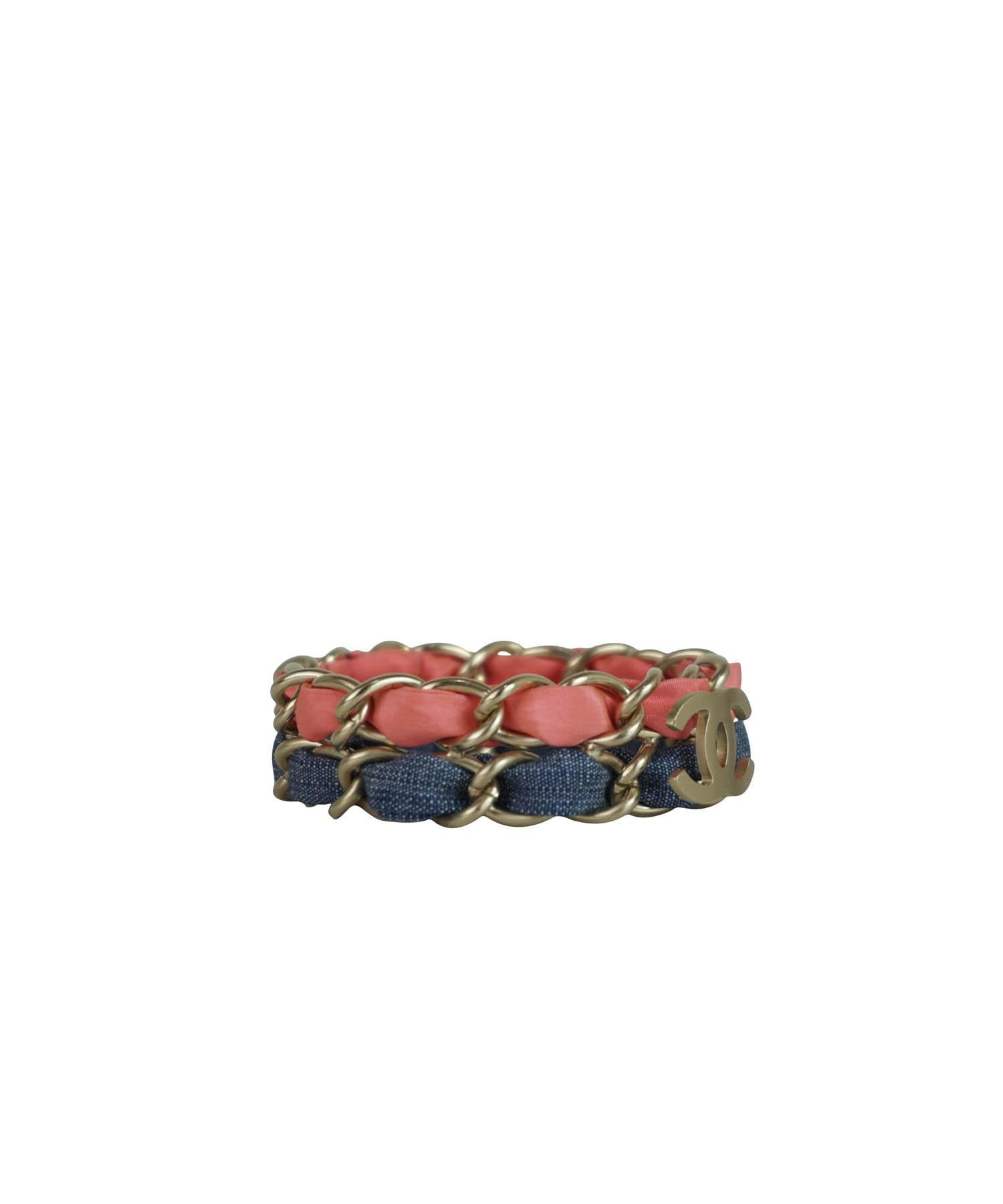 Chanel Y2K pink and blue denim fabric wrapped light gold chain CC bracelet. Features CC brushed gold closure at front, 2 rows of traditional Chanel fabric wrapped chain, no closure, chain is moveable. Please check measurements to be sure it will go
