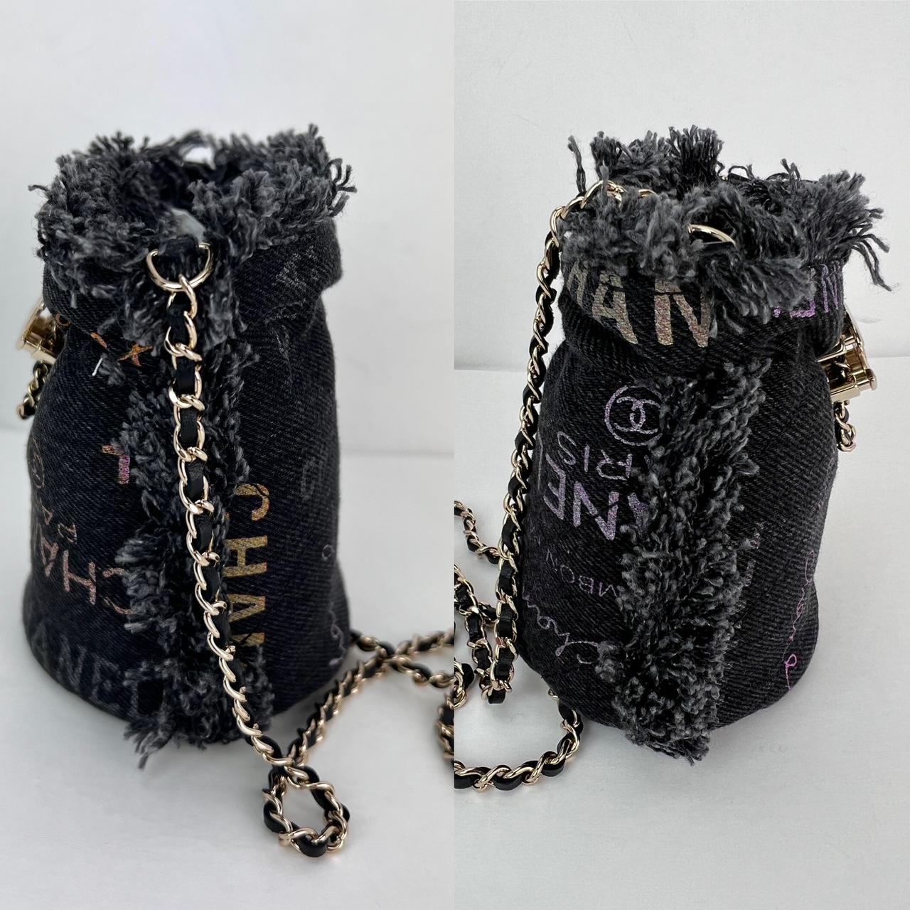 Pre-Owned  100% Authentic
Chanel Denim Quilted Mood Mini Bucket With Chain Black
This chic shoulder bag is crafted of luxurious diamond-quilted
denim in black. The bag features a black leather-threaded gold
 chain shoulder strap and a front cinch