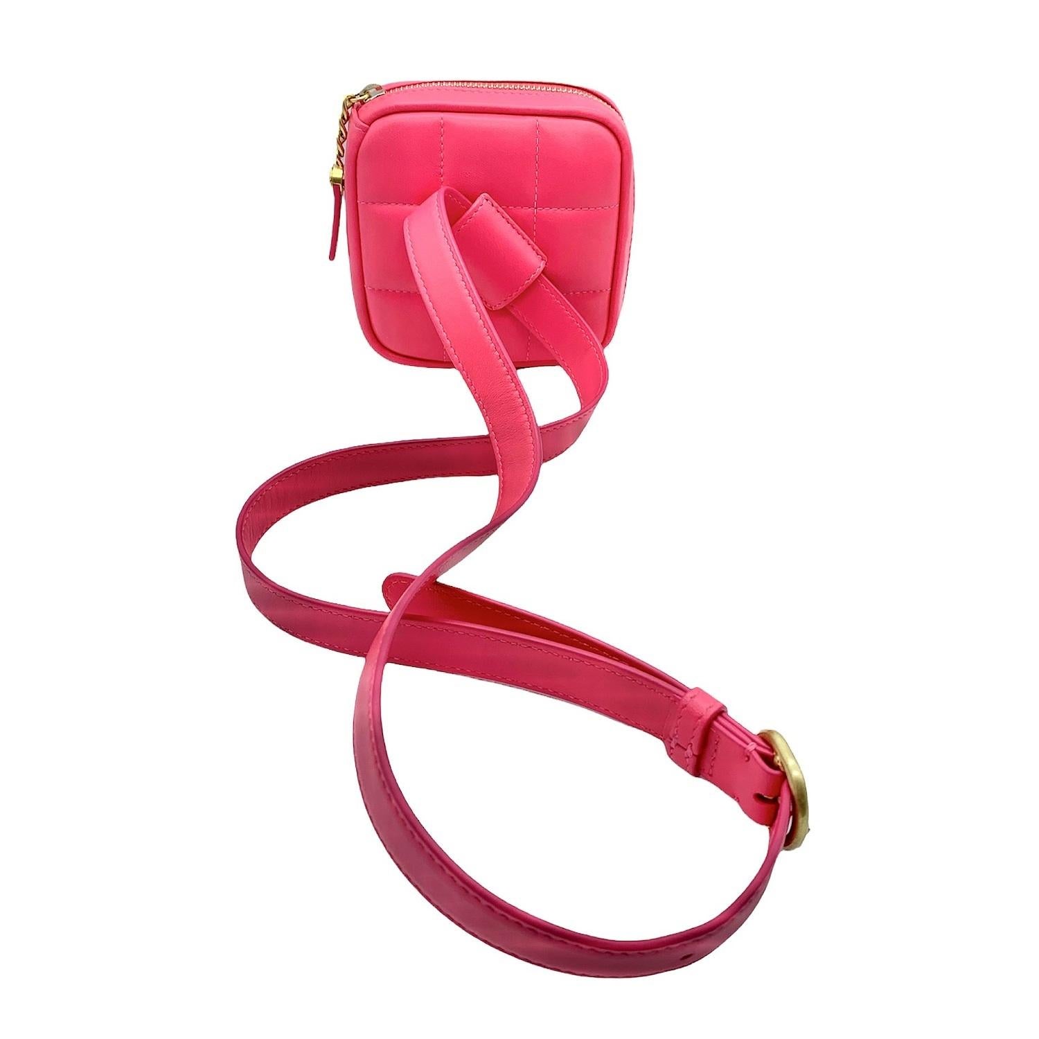 This stylish diamond belt coin purse is finely crafted of smooth Calfskin leather. The bag features a pink belt and gold hardware including a zipper that opens to a fine textile interior.

Designer: Chanel
Material: Calfskin leather
Origin:
