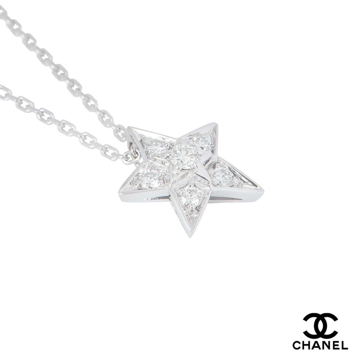 An 18k white gold star pendant by Chanel from the Comete collection. The pendant features a star motif with 6 round brilliant cut diamonds in total with 1 in the centre on a smaller star all in a claw setting with a total weight of 0.22ct. The