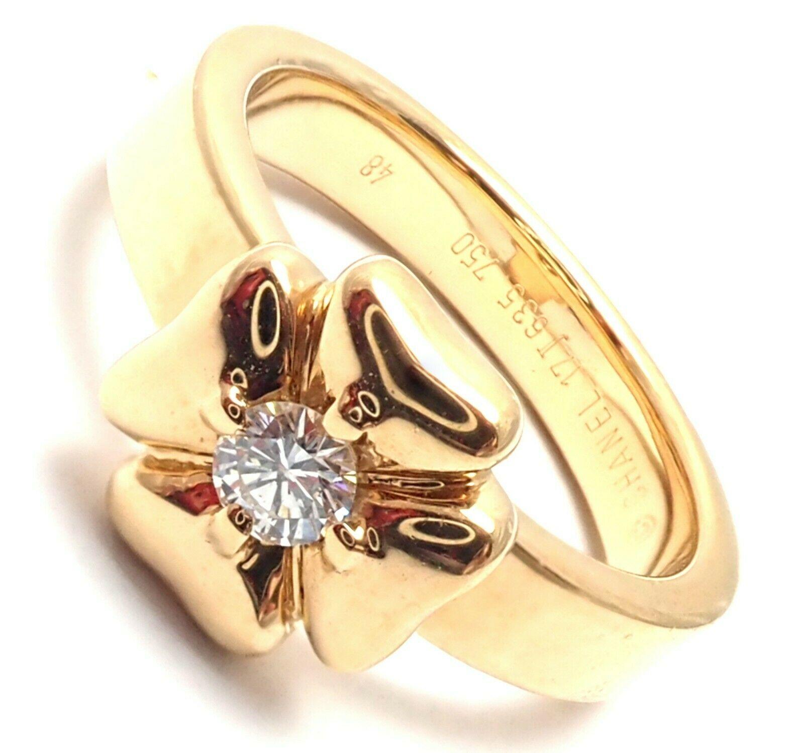 18k Yellow Gold Diamond Four Leaf Clover Band Ring by Chanel. 
With 1 Round Brilliant Cut Diamond Total Weight Approximately 0.12 ct. Diamond is G color and VS1 clarity.
Details:
Ring Size: US - 4.25. French - 48
Width: 3.5mm
Thickness: 1.5mm