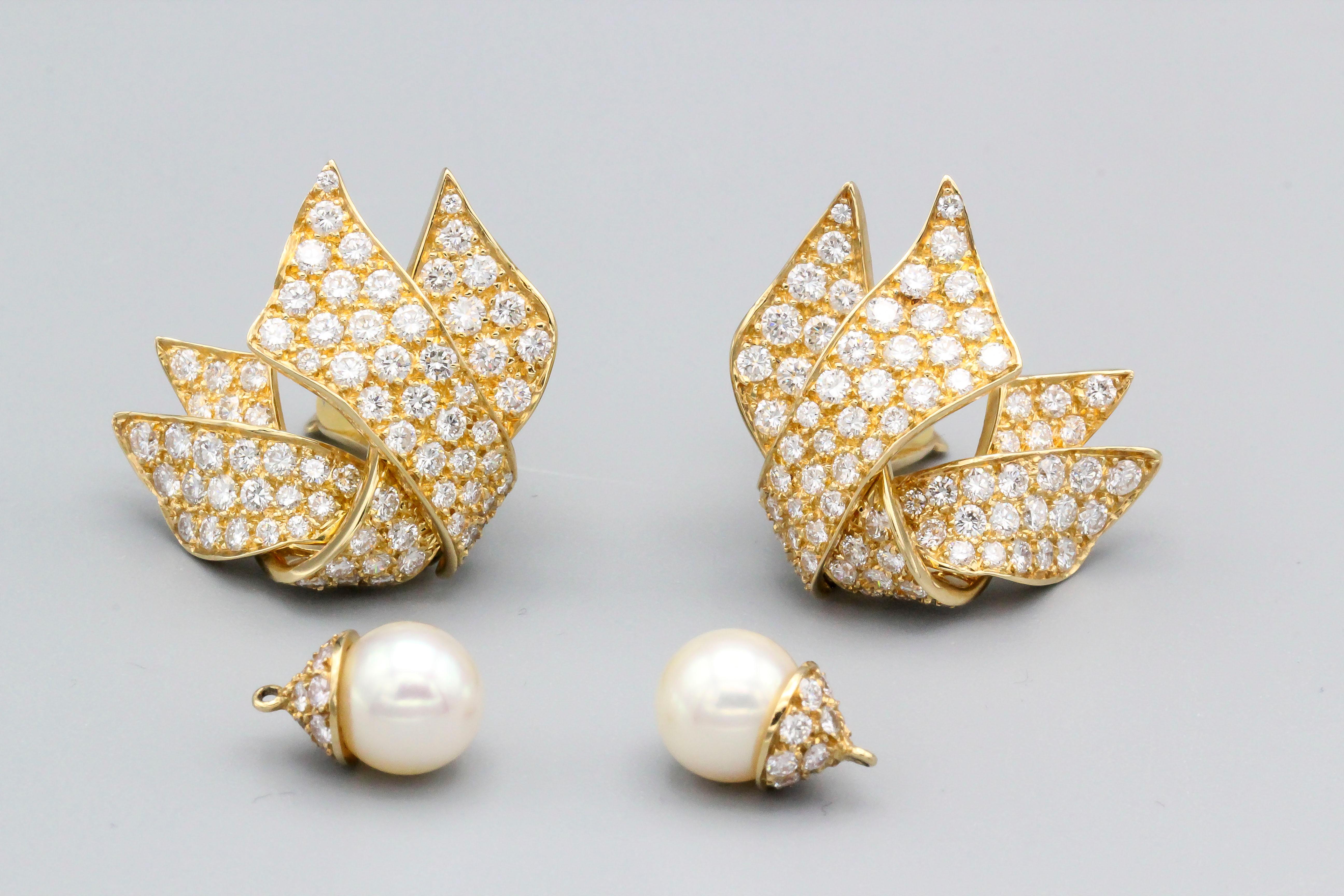 Chic diamond and 18K gold earrings with a removable pearl, by Chanel.   The pearl can be added in the nightime for a more striking effect. They feature high grade round brilliant cut diamonds of approx. 5-6 carats, the pearl measures 9 mm in