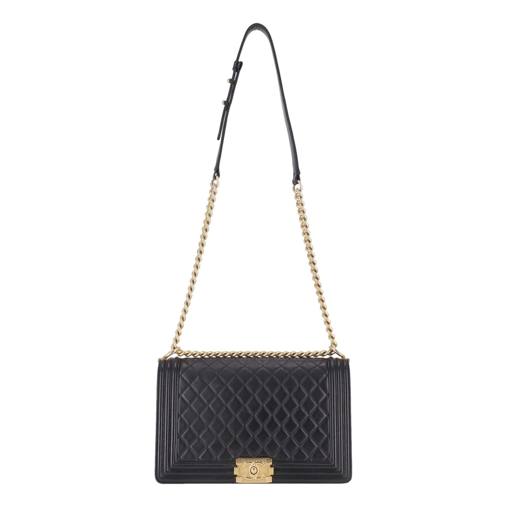 Chanel Diamond Quilted Lambskin New Medium Leather Boy Bag 

Black shoulder bag crafted of diamond quilted luxurious lambskin leather with a linear quilted border.

Designed with the Chanel's signature gold 'CC' logo Boy press-lock closure and a