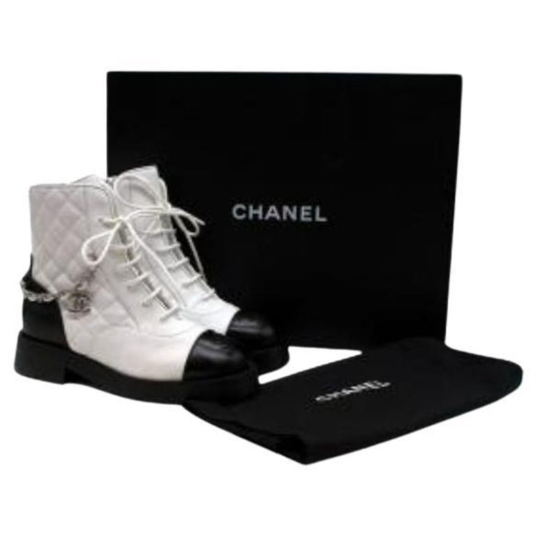 PAIR OF BLACK PATENT AND QUILTED LEATHER BIKER BOOTS, CHANEL