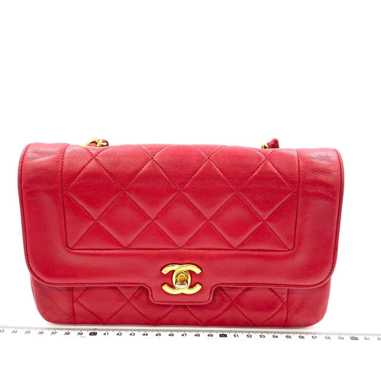 This one-of-a-kind Chanel Diana CC Flap Vintage bag exudes sophistication and timeless elegance. Crafted from luxurious red lambskin leather, it is adorned with 24k gold hardware. Made in between 1989-1991, this bag dates almost 30 years, remaining