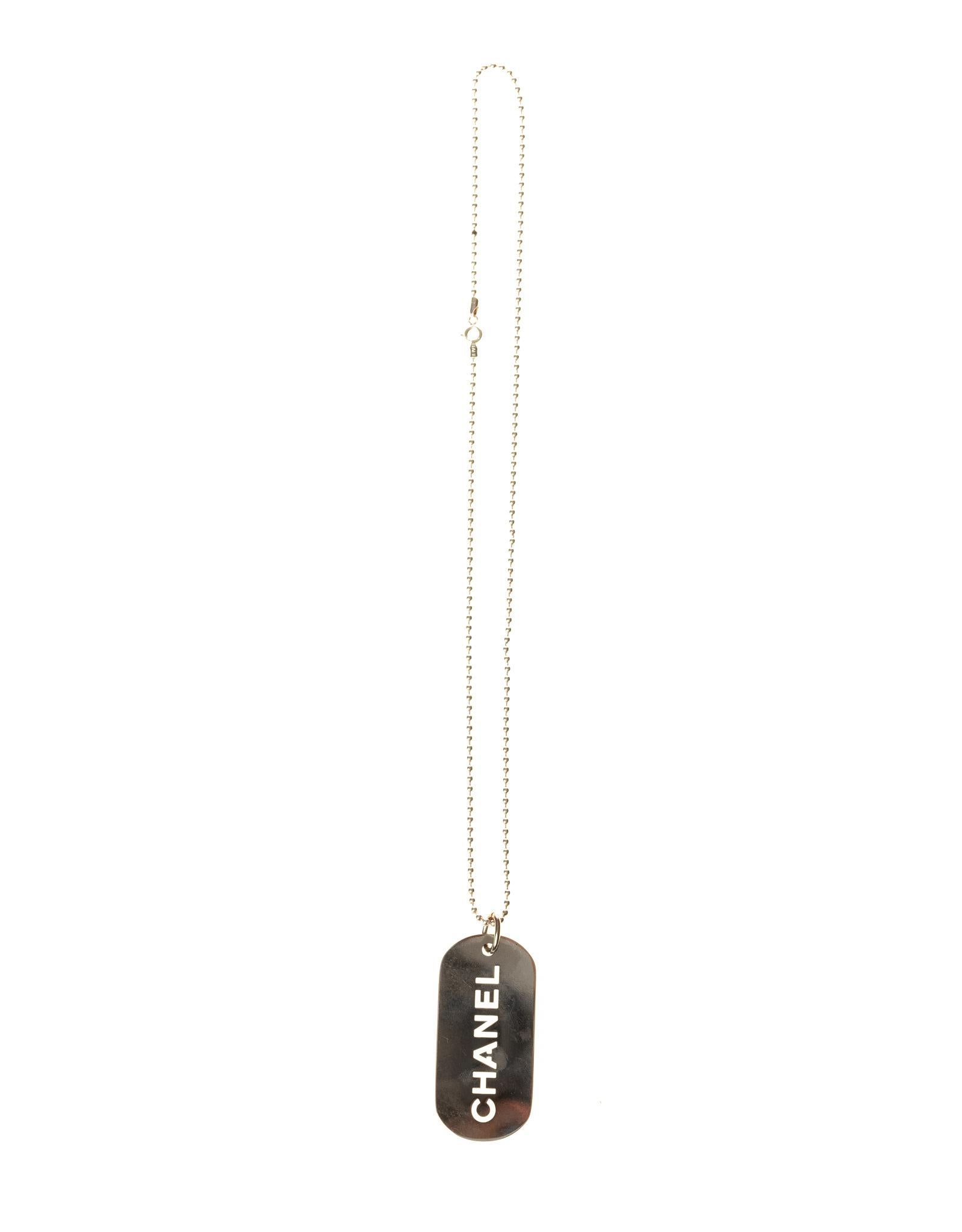 Chanel silver dog tag necklace, features a dog tag charm with the Chanel name engraved, see through. This is a unique necklace with the timeless quality and style of Chanel!

COLOR: Silver
MATERIAL: Metal
ITEM CODE: 278091
MEASURES: chain length