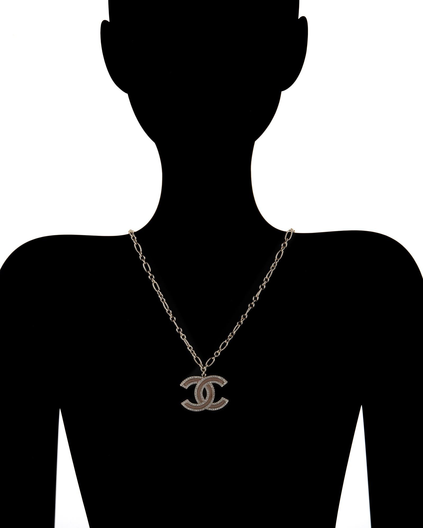 Stylish Chanel Double C logo crystal necklace crafted in light yellow gold tone, circa 2015 

Small 1mm faceted crystals are set into the double C's. The crystals are in-tact and in excellent condition (free of cracks or chips) 

The necklace dates