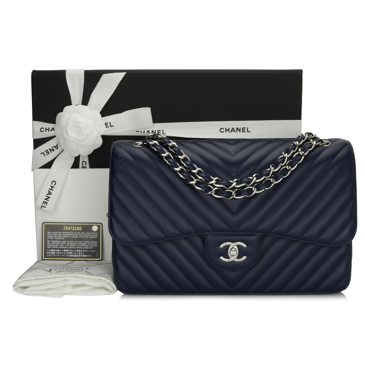 Authentic CHANEL Classic Double Flap Jumbo Bag Chevron Navy Caviar with Silver Hardware 2017.

This stunning bag is in pristine condition, the bag still holds its original shape well, and the hardware is still very shiny. The leather smells fresh as