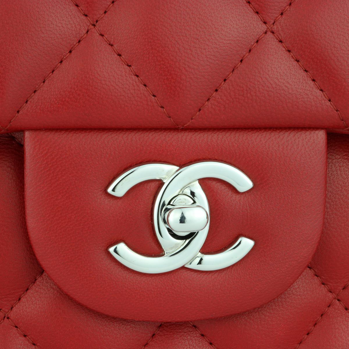 Authentic CHANEL Classic Double Flap Jumbo Bag Red Lambskin with Silver Hardware 2013.

This stunning bag is in mint condition, the bag still holds its original shape, and the hardware is still very shiny. Leather still smells fresh as if
