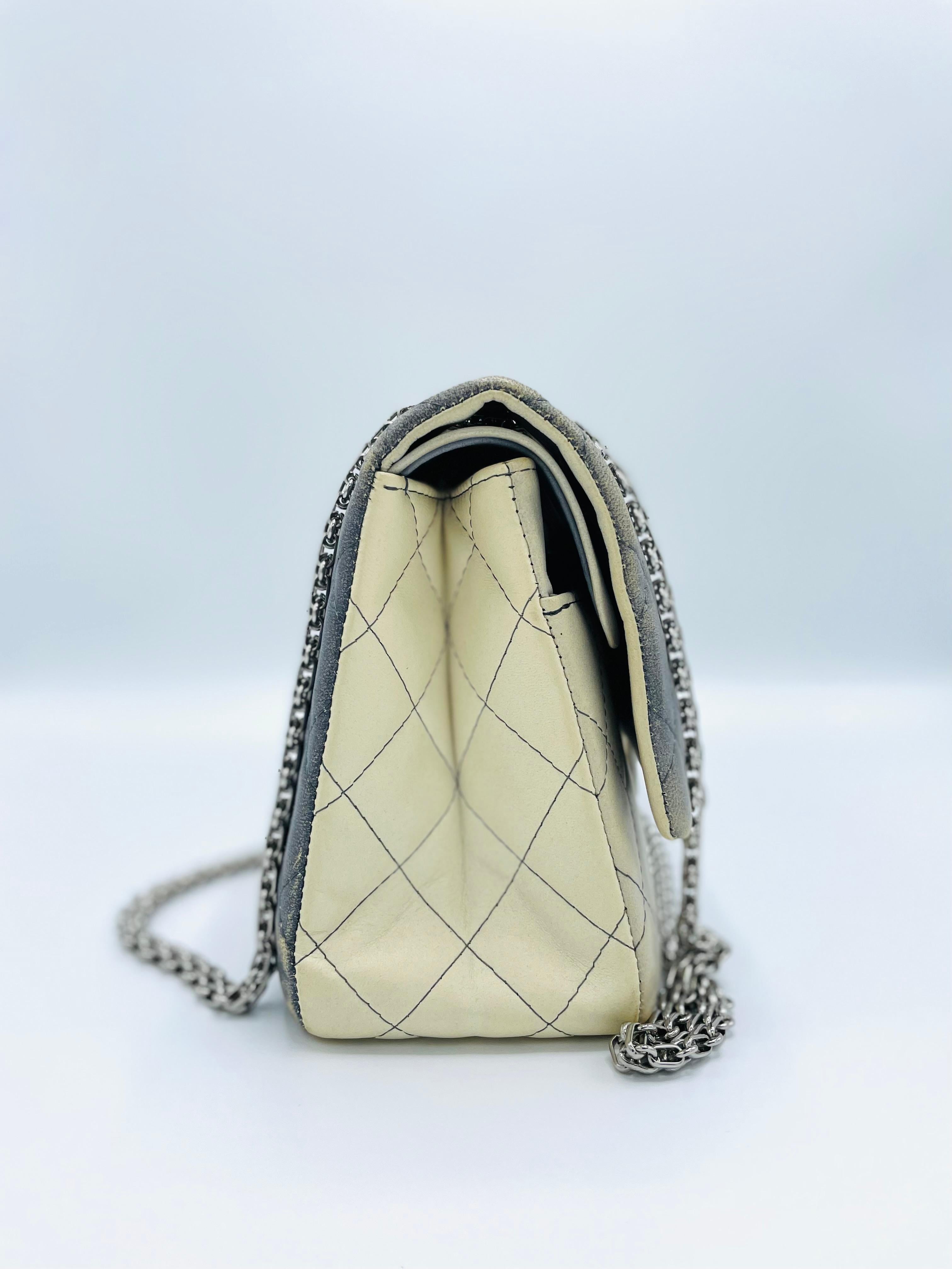 Chanel Double Hybrid Degrade Ombre Grey & Cream Quilted Lambskin 2.55 Reissue 227 Double Flap Shoulder Bag. The handbag is made from a luxurious ombre grey and cream quilted lambskin with silver hardware. It also incorporates the Mademoiselle Lock