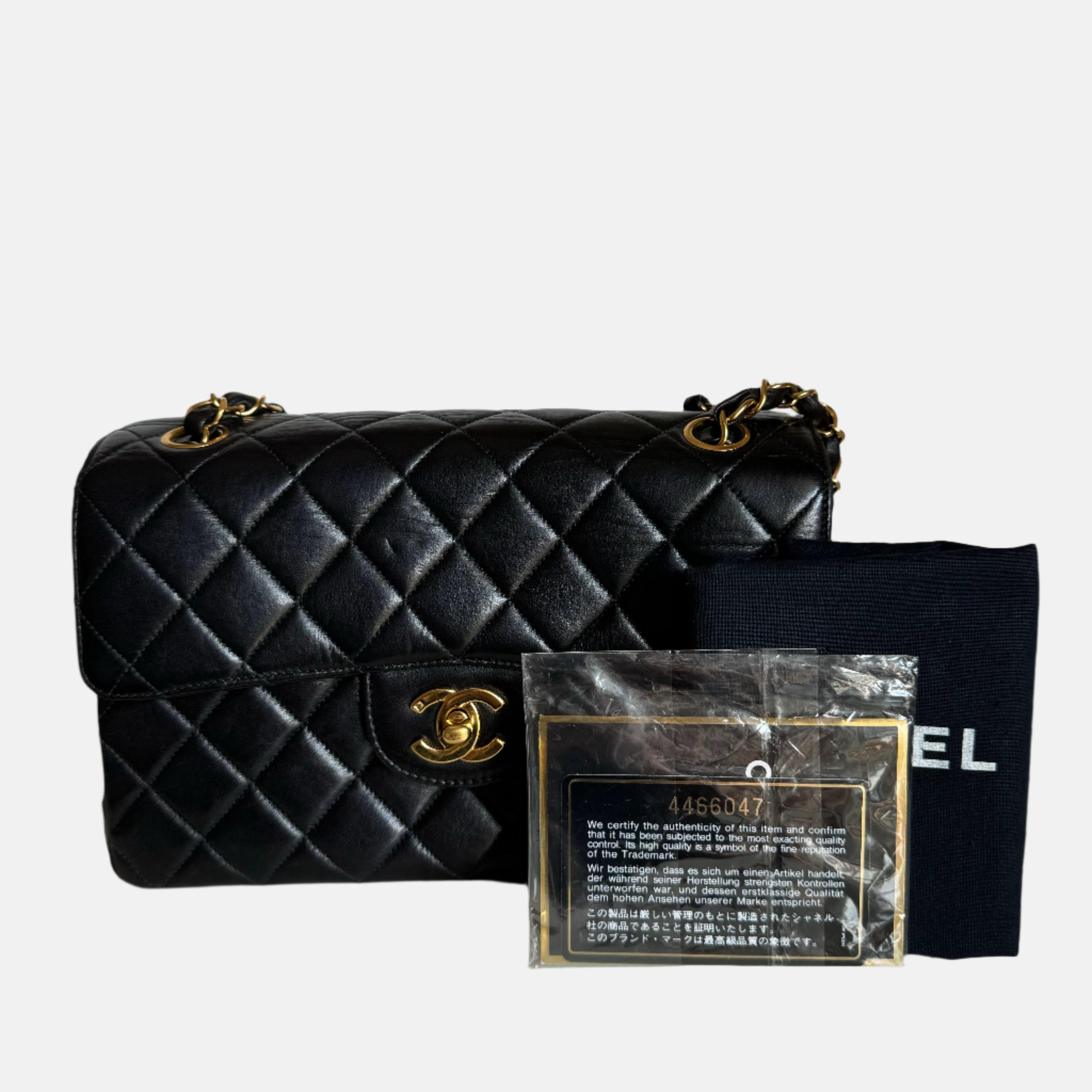 Chanel Double Sided Small Classic Flap Black Lambskin Leather 24k Gold Hardware, 1996-1997
 These are professional photos of the actual bag offered by Luxbags.
 This rare exquisite Chanel handbag is double the style with its two-sided design! Its
