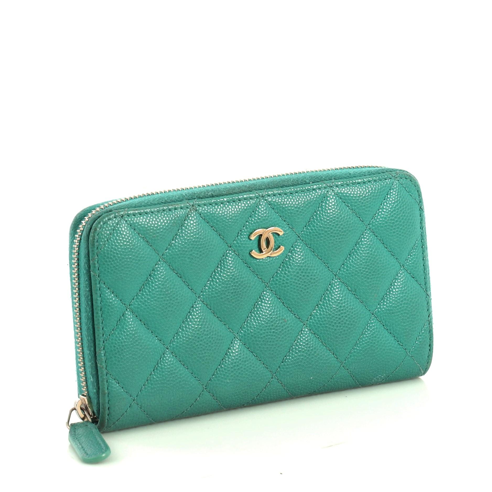 This Chanel Double Zip Around Wallet Quilted Caviar Small, crafted from green quilted caviar leather, features CC logo at the front and gold-tone hardware. Its zip closures open to a green leather interior with zip and slip pockets. Hologram sticker