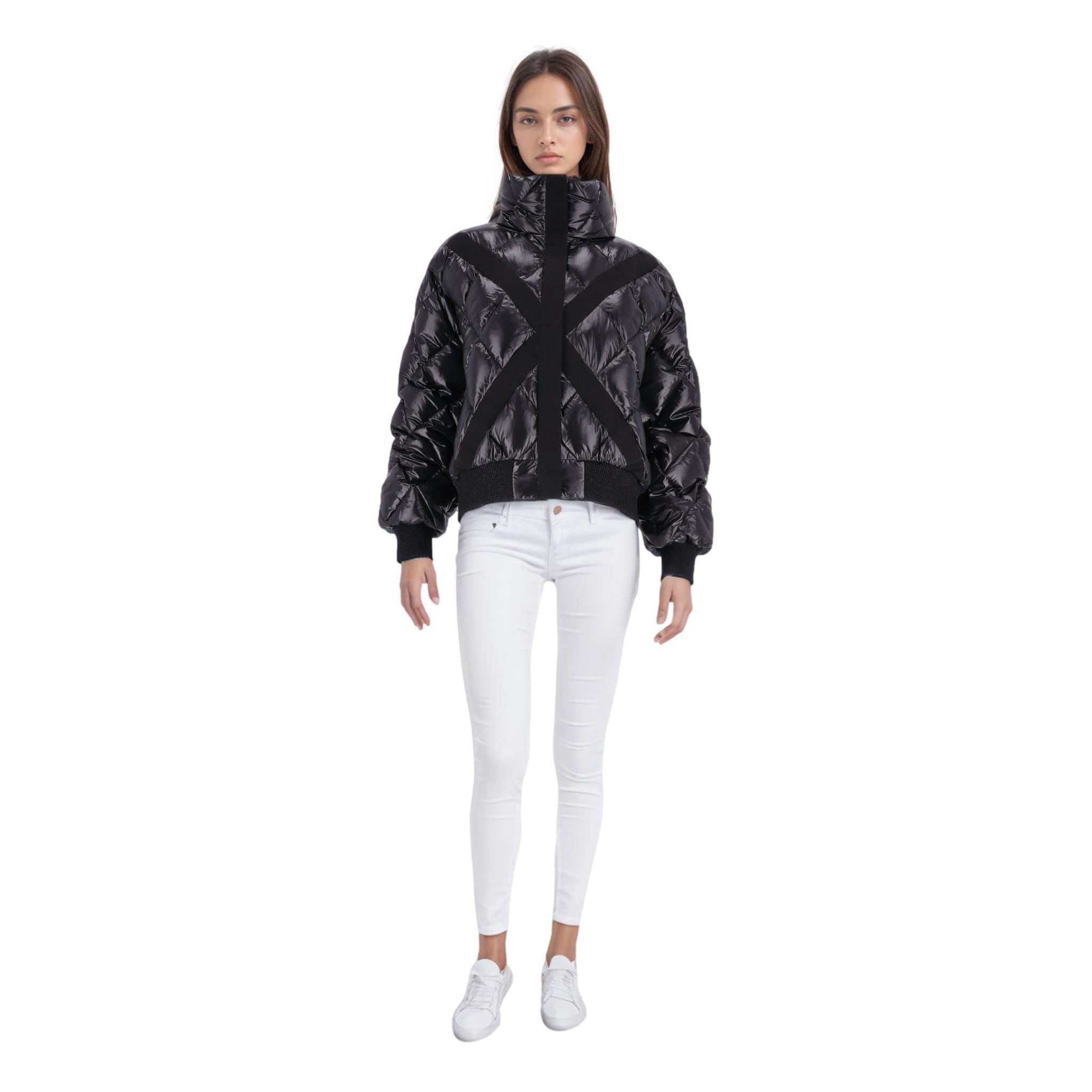 Chanel Down Puffer Coat/Jacket With 'CC' Logo Patch

Black jacket with goose down and duck feathers filled glossed-shell.

Detailed with snowflake shaped tweed embroidered patch to the sleeve with white 'CC' logo and trim.

Featuring tonal cross