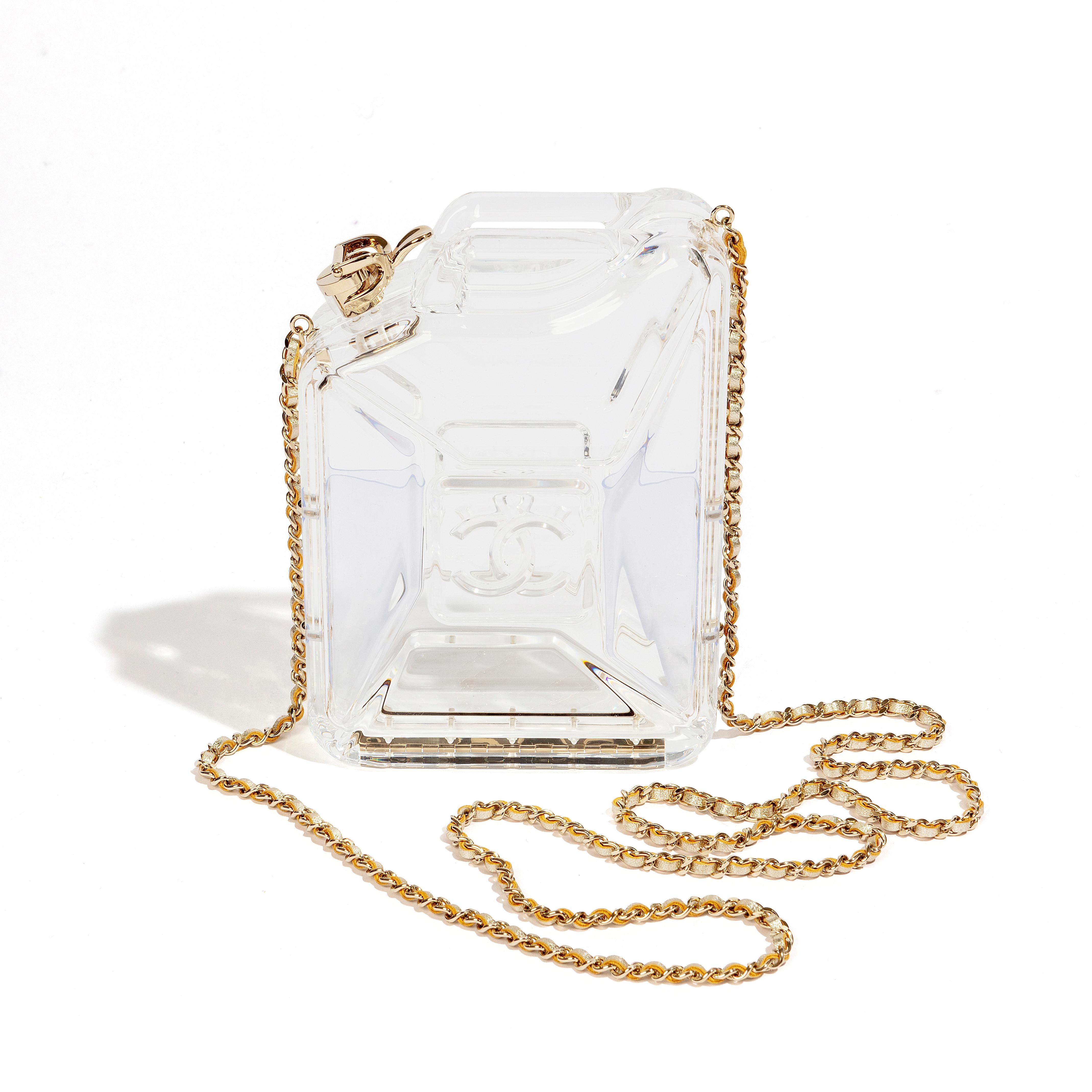 This exquisite item is a Limited Edition 2015 Chanel Dubai By Night Cruise Collection Minaudiere. The clutch is crafted from high-quality clear Plexiglass and features beautiful gold-tone hardware that adds a touch of elegance to the overall design.