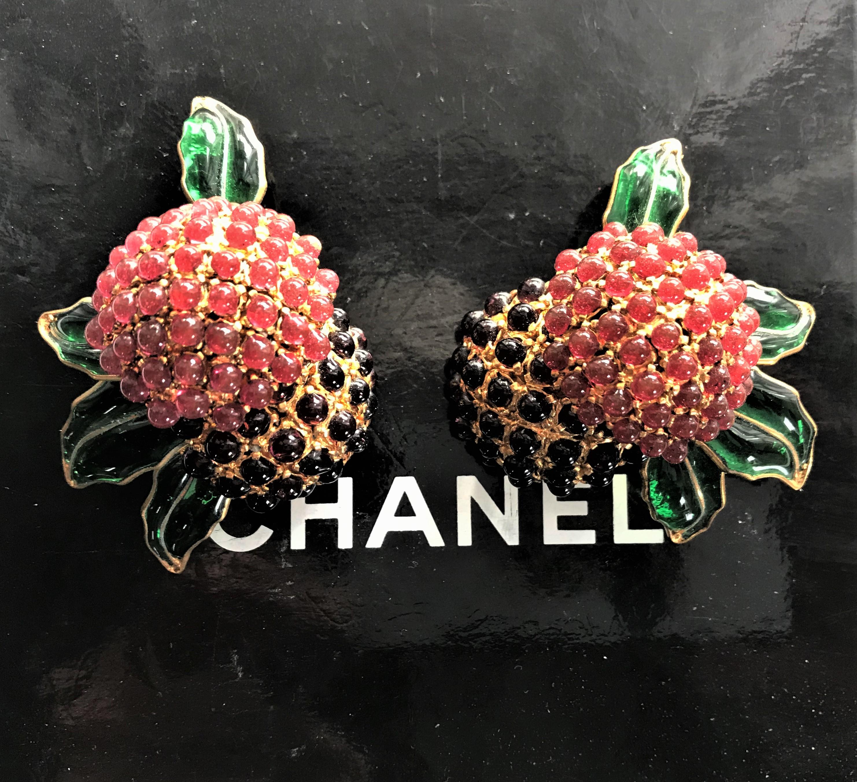 A unique pair of Chanel ear clips worked in house at Gripoix and Goossens Paris. 
Wonderful Chanel ear clips are made up of a red and black blackberry and green leaves. A hemisphere was made from many small Gripoix balls in red and black. The red