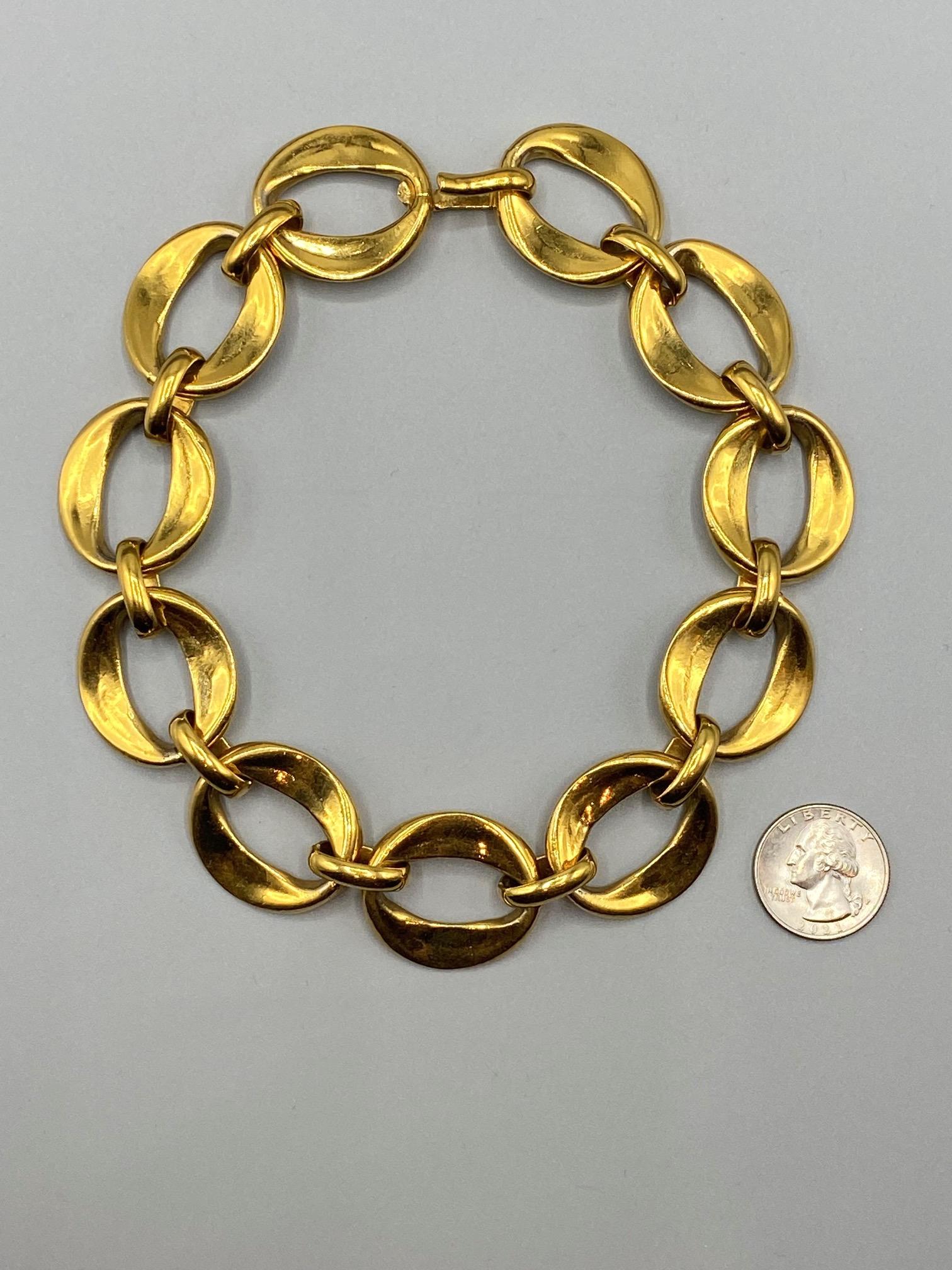 Chanel early 1980s large link 18K gold plate large link necklace. The larger oval links are cast wider, .25 of an inch, on the ends so the front and back have a concave design. The middle of the links are .13 of an inch thick. Each link is 1.13 inch