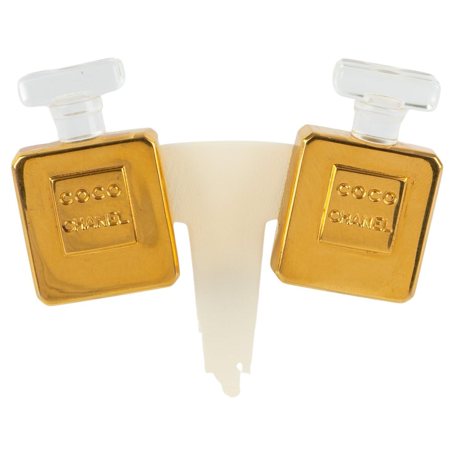 Chanel earrings 
bottle of perfume
 For Sale