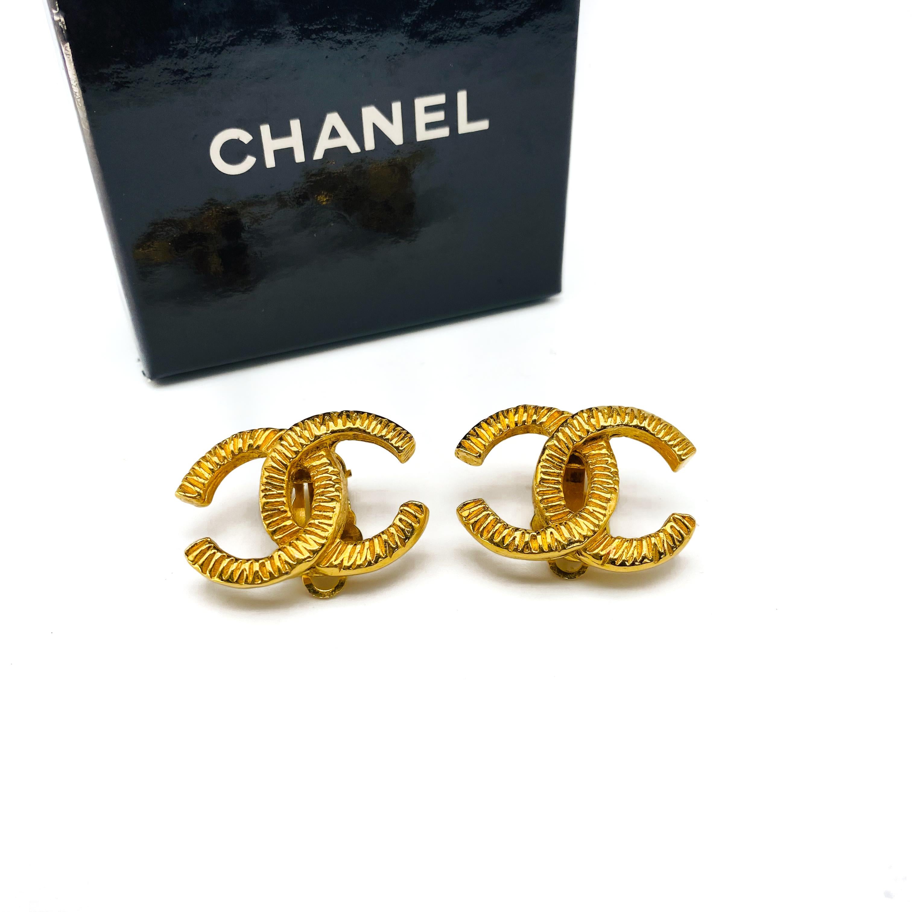 Chanel 1970s Vintage CC Clip On Earrings

Timeless and iconic statement earrings from the house of Chanel, still the most desirable fashion brand in the world. Made in France in the 1970s, these rare earrings are cast from beautifully textured gold