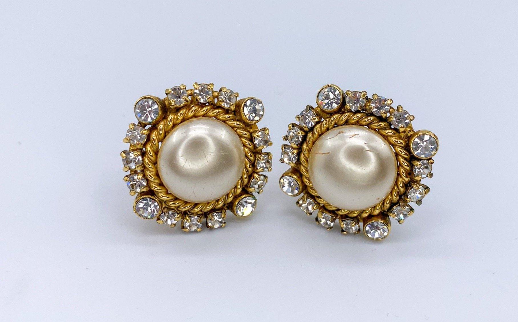 Chanel Vintage 1980s Clip On Earrings. 

Cast from gold plated metal, featuring beautiful baroque faux pearls surrounded by sparkling rhinestones. These are true showstoppers for women with confidence. 80s Chanel is all about bold and gold statement
