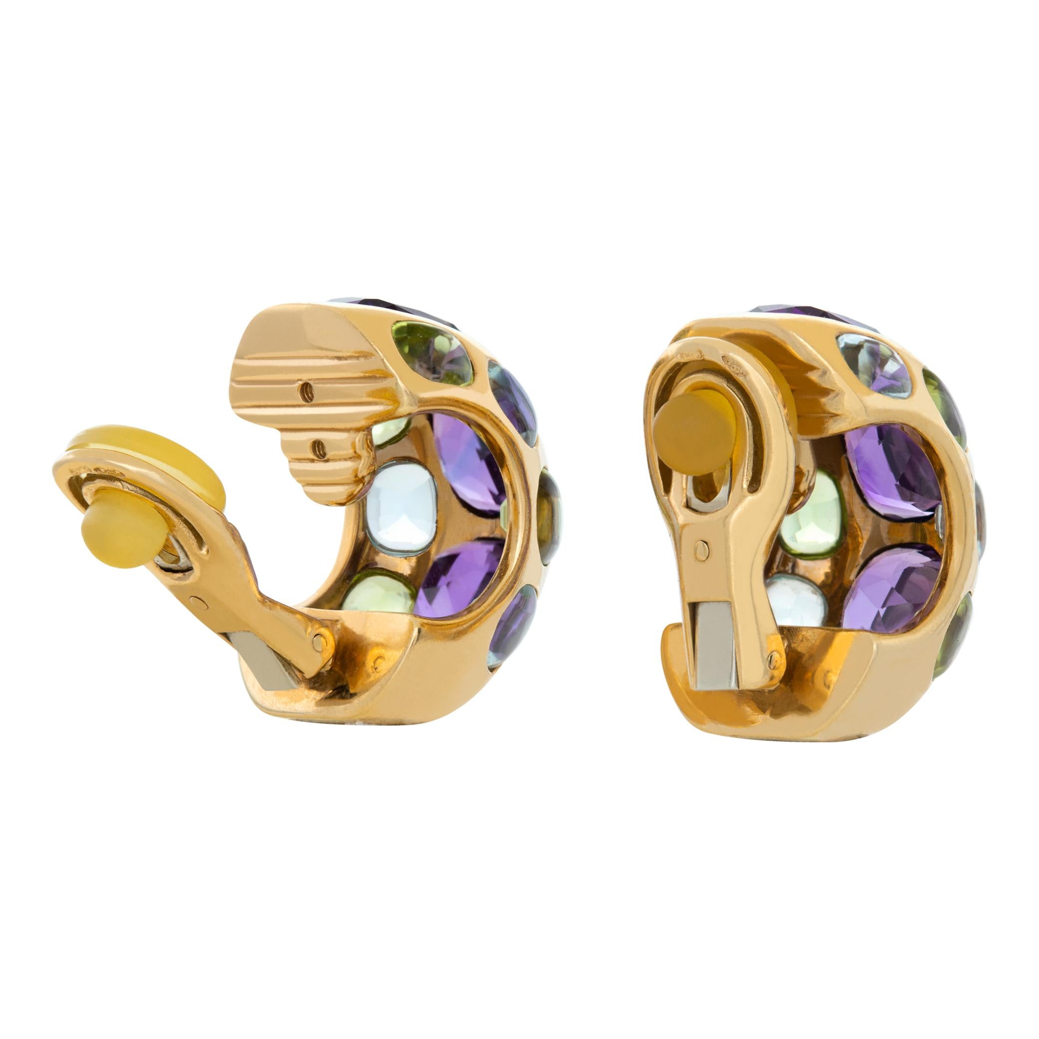 Colorful Chanel earrings with amethyst, peridot and aquamarine in 18k yellow gold. Clip on (post can be added). Width: 0.5 inches. Length: 0.85 inches.