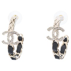 Chanel Earrings with gilt metal, black leather and crystal