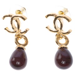 Chanel Earrings with gold metal and brown stone