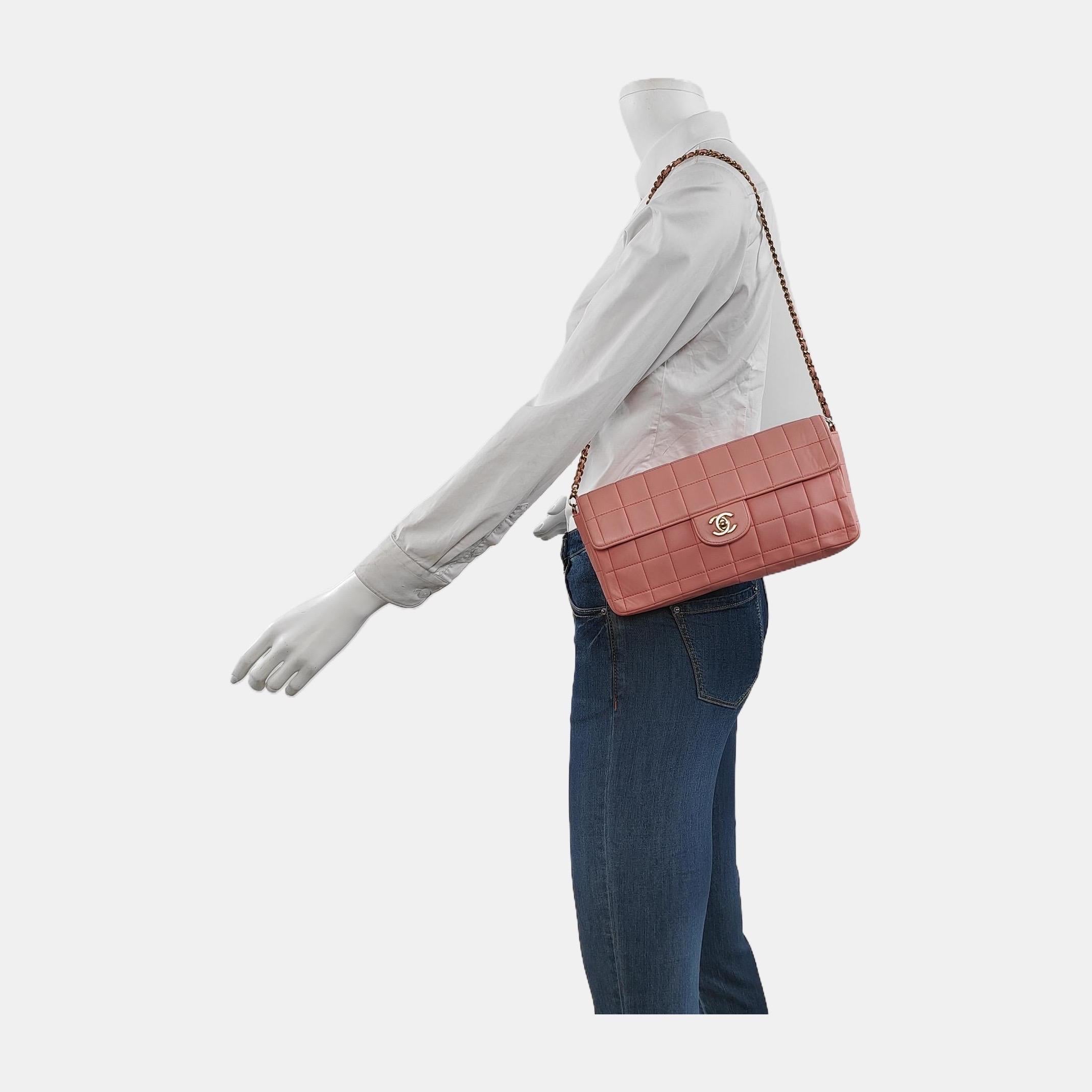 This charming Vintage Chanel East West Leather Shoulder Bag is a stylish mix of classy and casual. The elongated shape gives its 