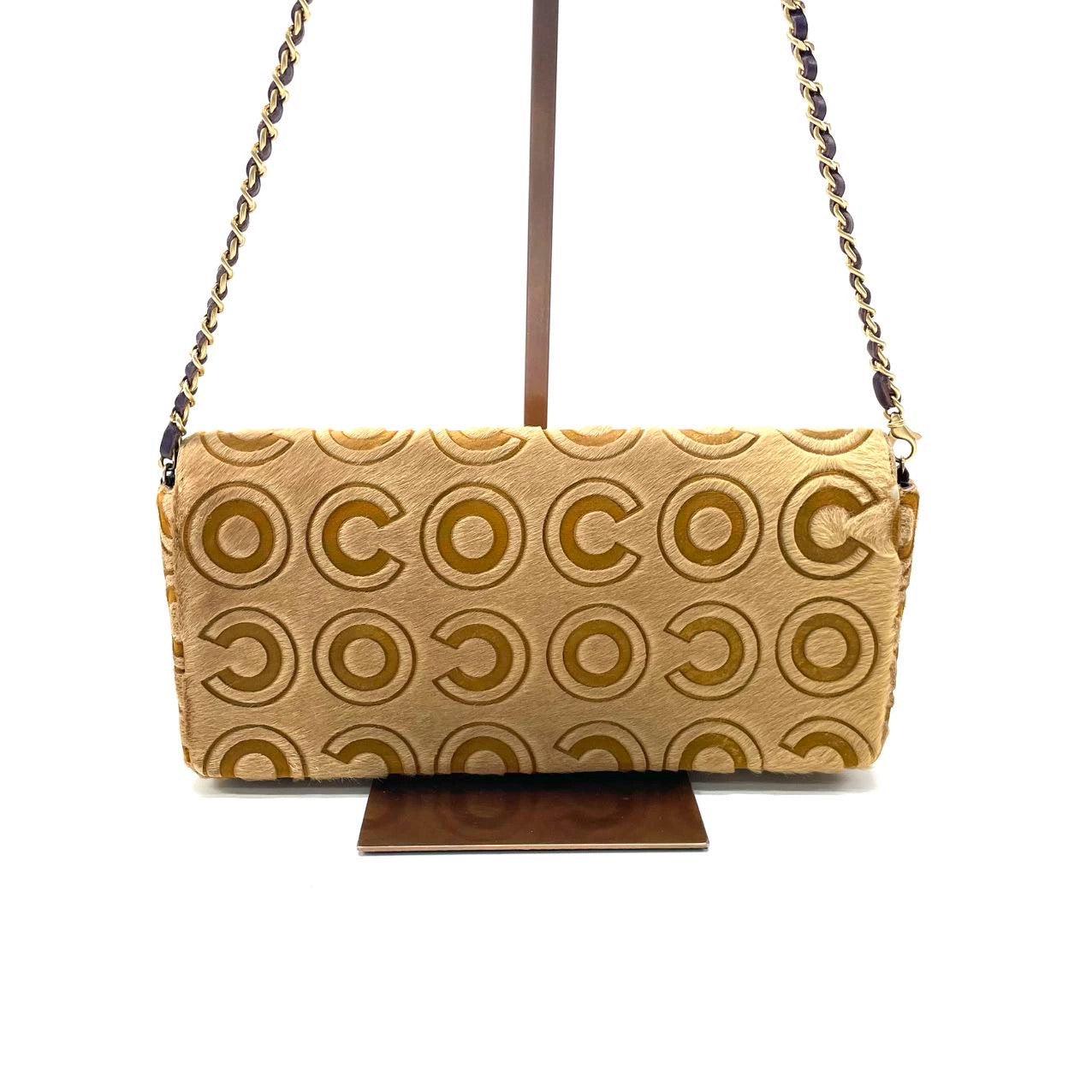Chanel East West Rare Tan Brown Pony-hair Calfskin Leather CC Logo
 These are professional photos of the actual bag.
 This charming Vintage Chanel East West Leather Shoulder Bag is a stylish mix of classy and casual. The elongated shape gives its