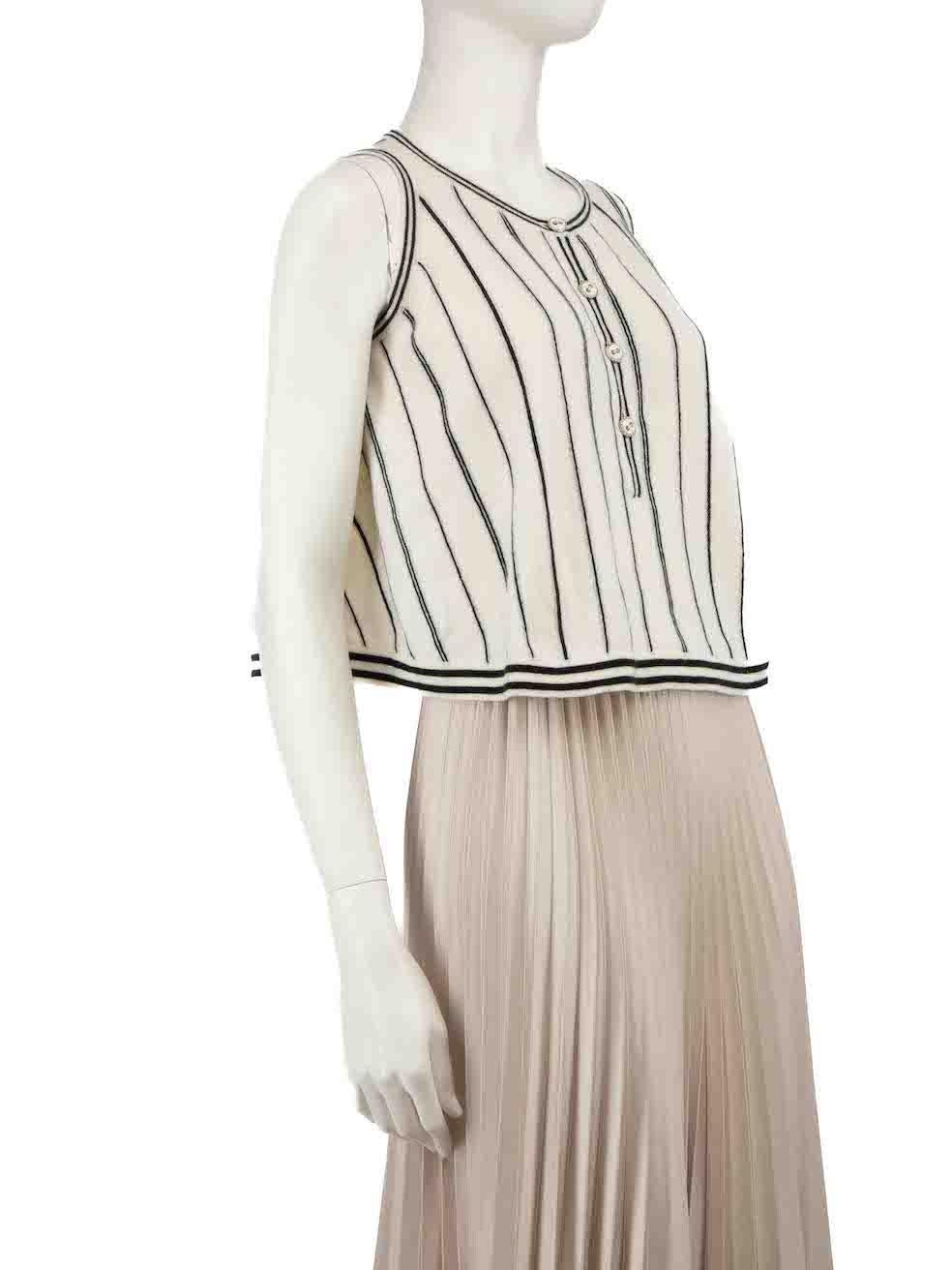 CONDITION is Very good. Hardly any visible wear to top is evident on this used Chanel designer resale item.
 
 
 
 Details
 
 
 Ecru
 
 Cashmere
 
 Sleeveless top
 
 Knitted and stretchy
 
 Striped pattern
 
 Round neckline
 
 Front button up