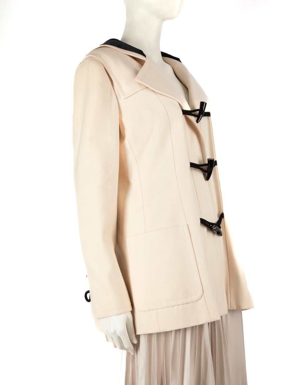 CONDITION is Very good. Minimal wear to coat is evident. Minor discolouration marks on the right panel, on the pocket and near the buttons of the left panel on this used Chanel designer resale item.
 
 Details
 Ecru
 Wool
 Coat
 Single breasted
