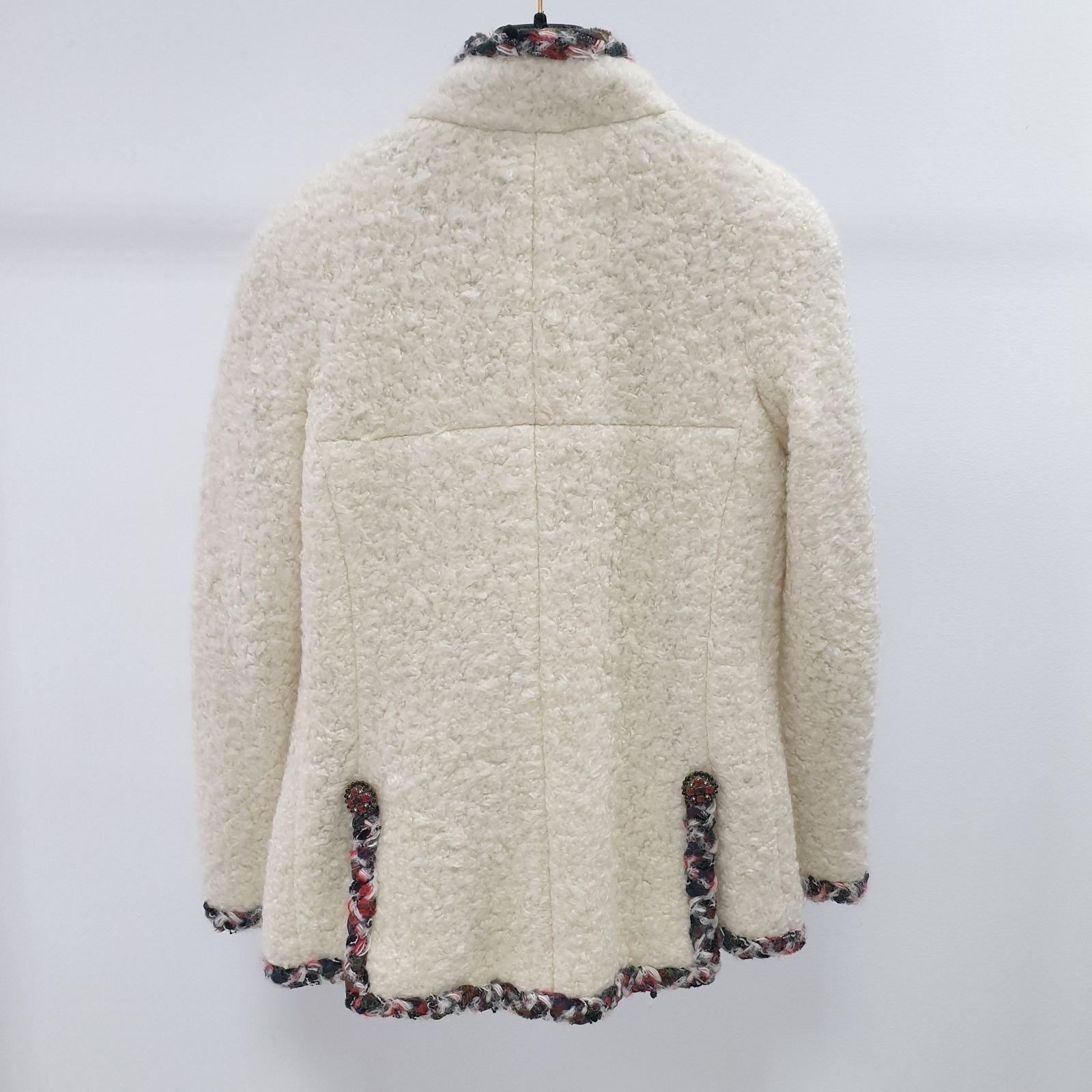 Hard to meet Chanel white faux fur jacket from Catwalk of Paris / EDINBURGH Collection, 2013 Pre-Fall Metiers d'Art 
Retail price over 9,000$. 
- CC logo jewel Gripoix button 
- signature contrast braided tartan trim
 - full silk lining
Sz.36
very