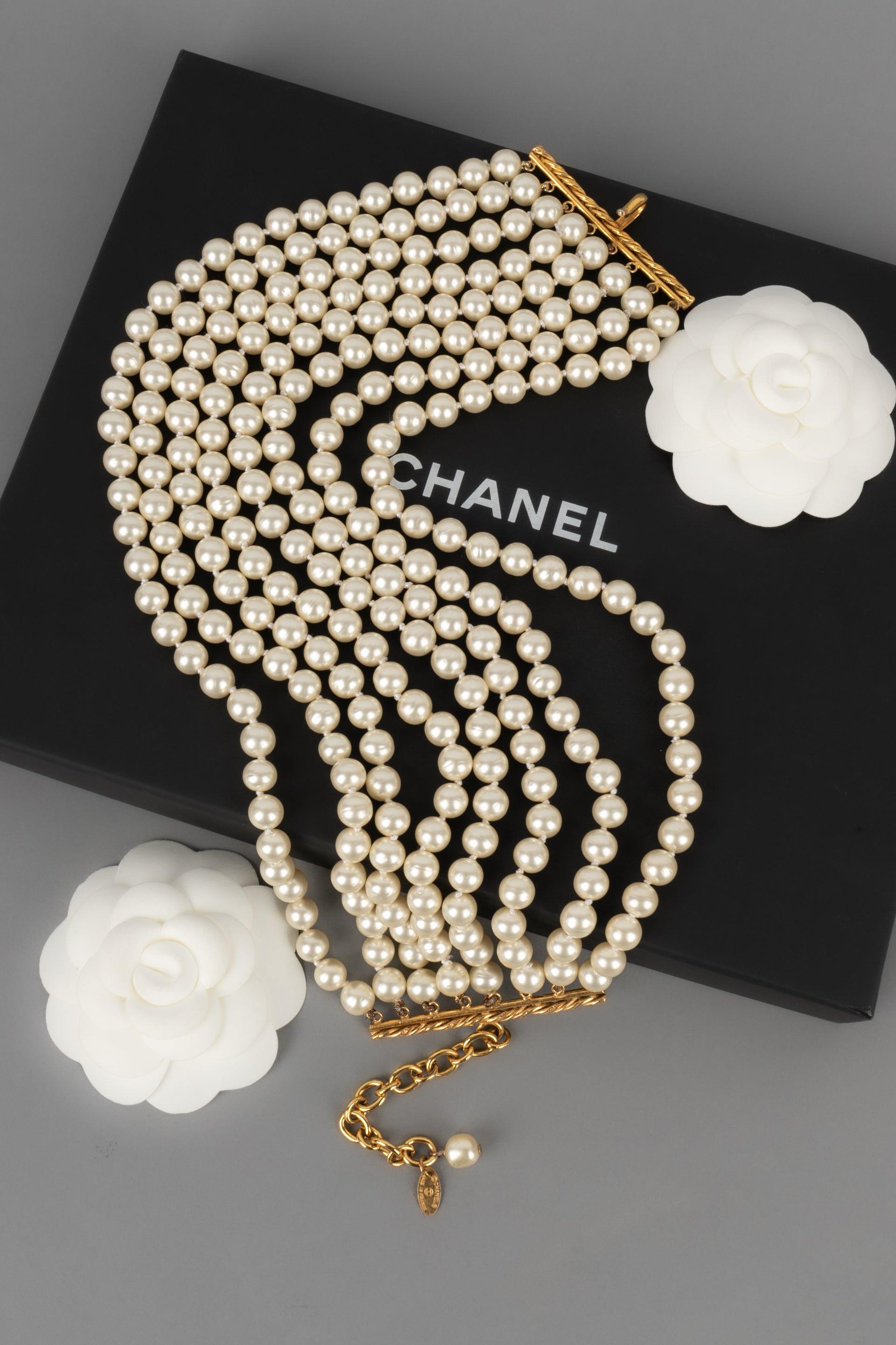 Chanel - (Made in France) Eight-row choker necklace with costume pearls. Jewelry from the 1980s.

Additional information:
Condition: Very good condition
Dimensions: Length: from 32 cm to 40 cm

Seller Reference: CB237