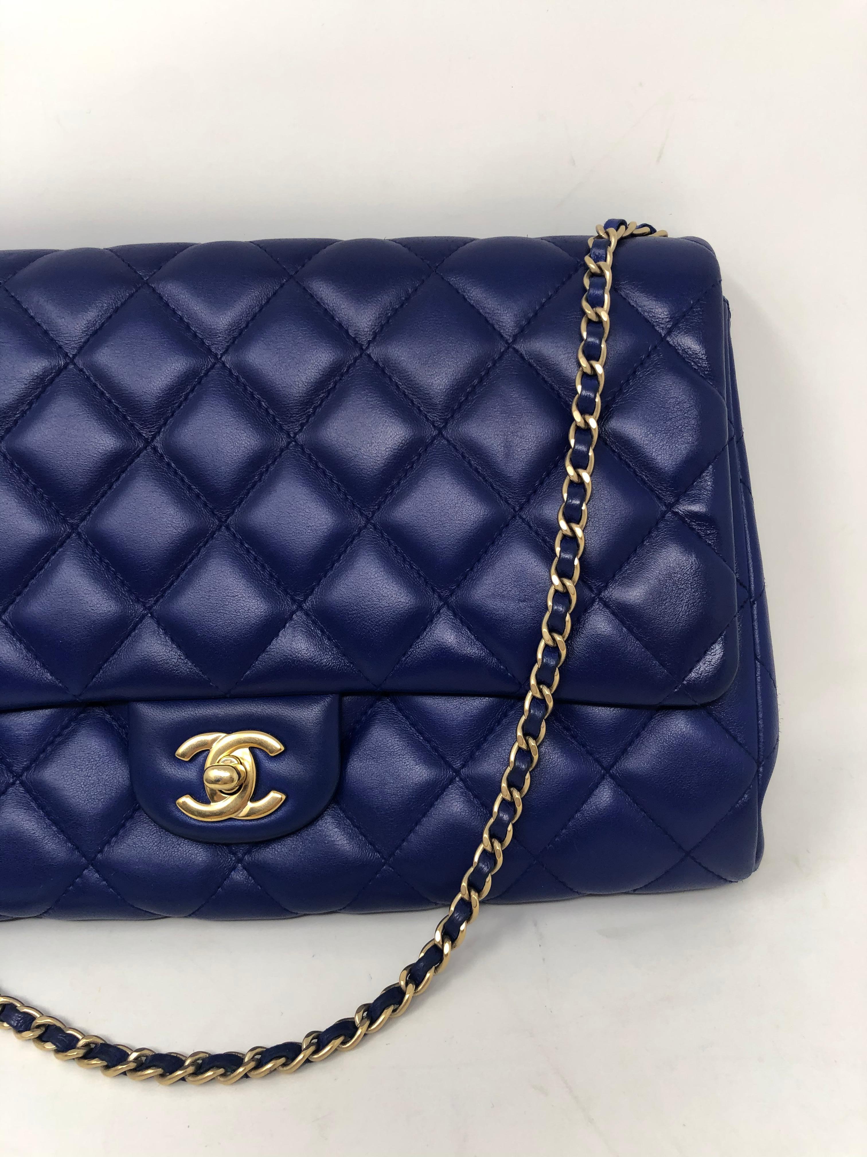 Chanel Electric Blue Lambskin Bag. Gold hardware. Can be worn as clutch or shoulder bag. Good condition. Light wear slight transfer on back of bag. Medium 11