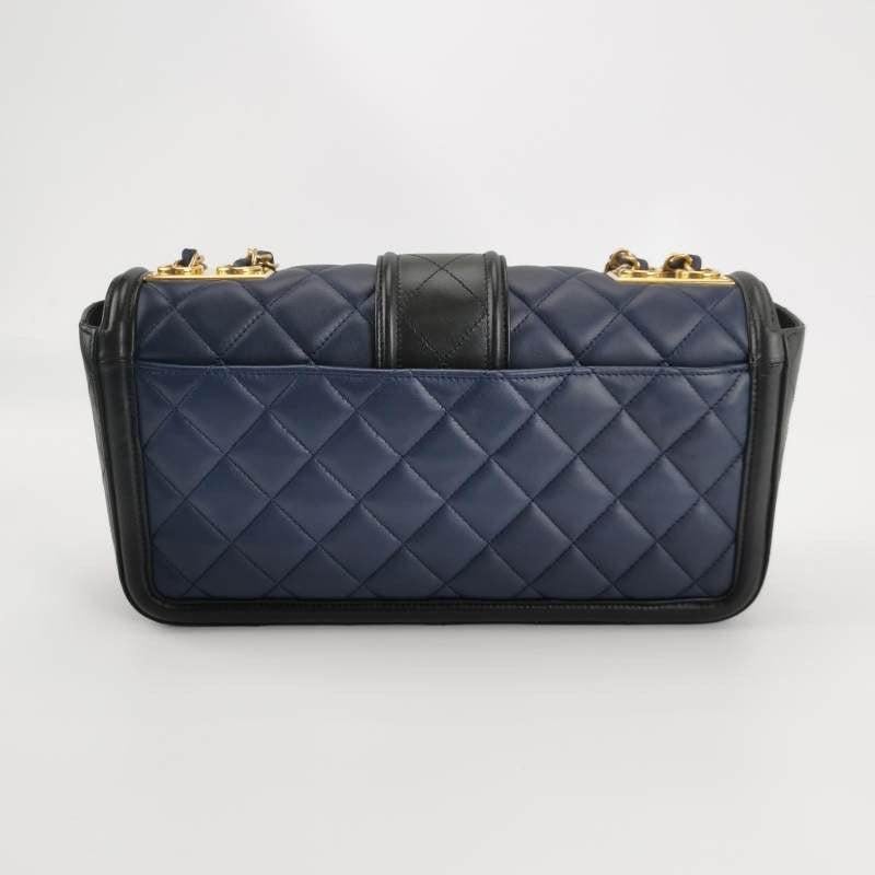 Chanel Elegant CC Flap Bag Navy Black Quilted Medium

  This Chanel baguette shoulder bag showcases a stunning blend of navy and black hues, complemented by sleek gold hardware. Slightly shorter than the classic flap, this bag boasts an elegant