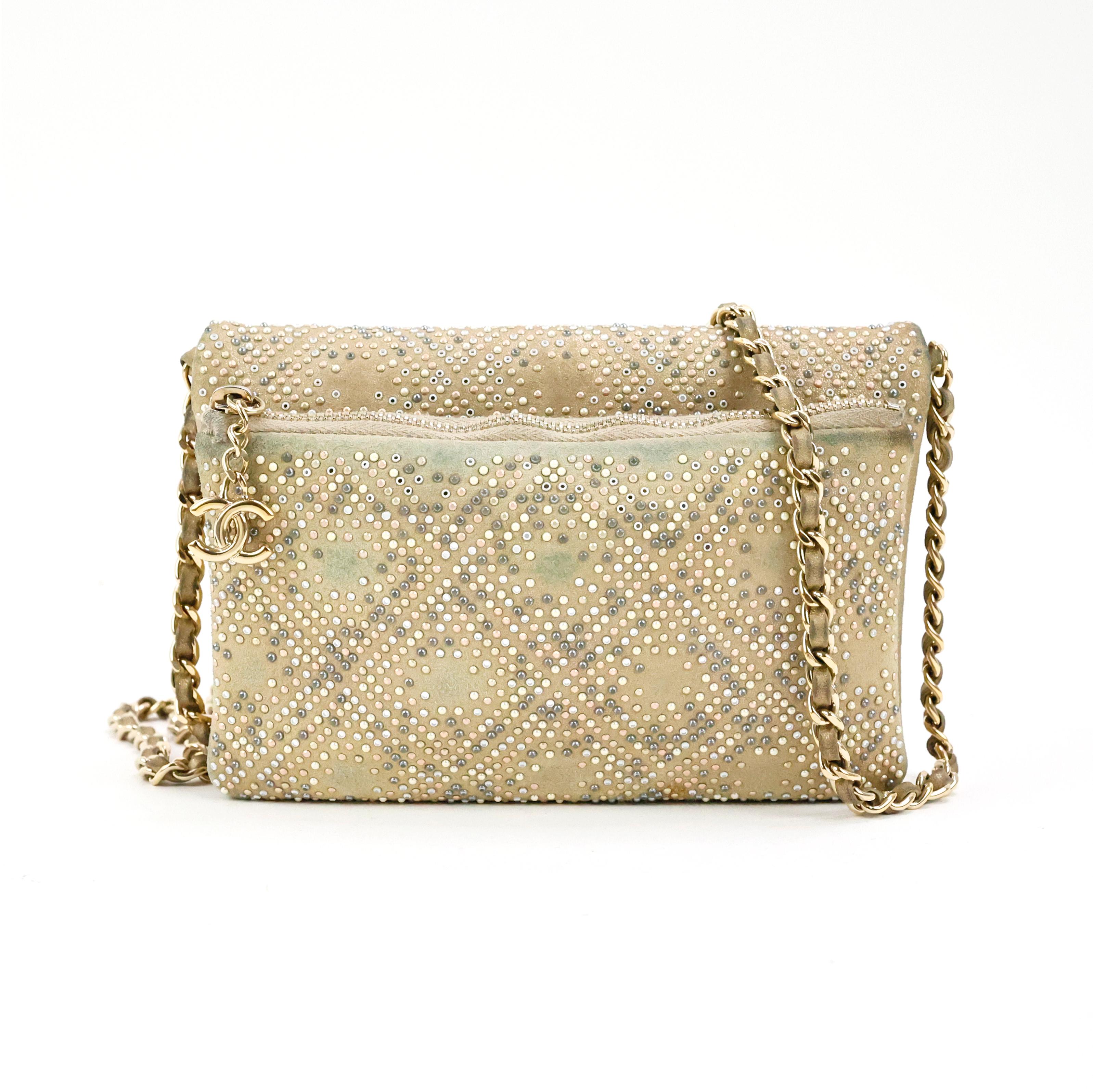 Rare Chanel embellished mini flap bag, in leather color gold, all over beaded with micro pearls, stones and mirrors, gold hardware.

Condition:
Good, pre-loved piece with signs of wear on the