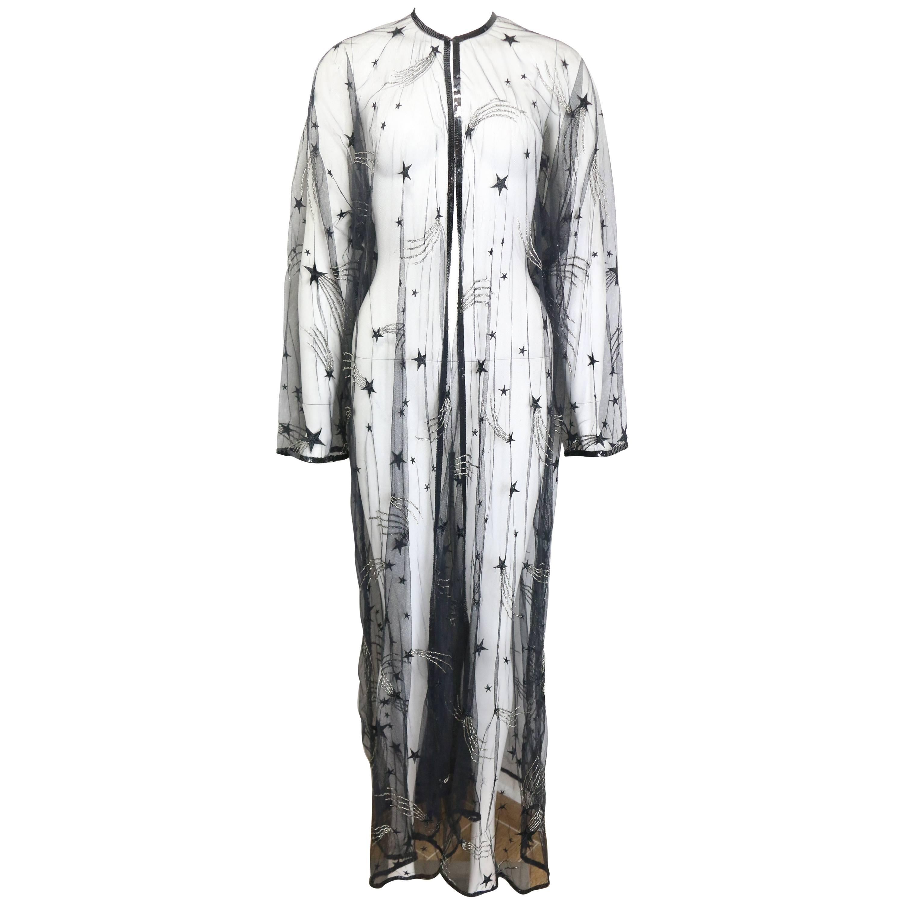 - Vintage Chanel embroidered see through evening dress gown from the late 80s collection. A very classic and one of the early years of Karl Lagerfeld masterpiece in Chanel! 


- Featuring black sequins piping trims, a black embroidered star with