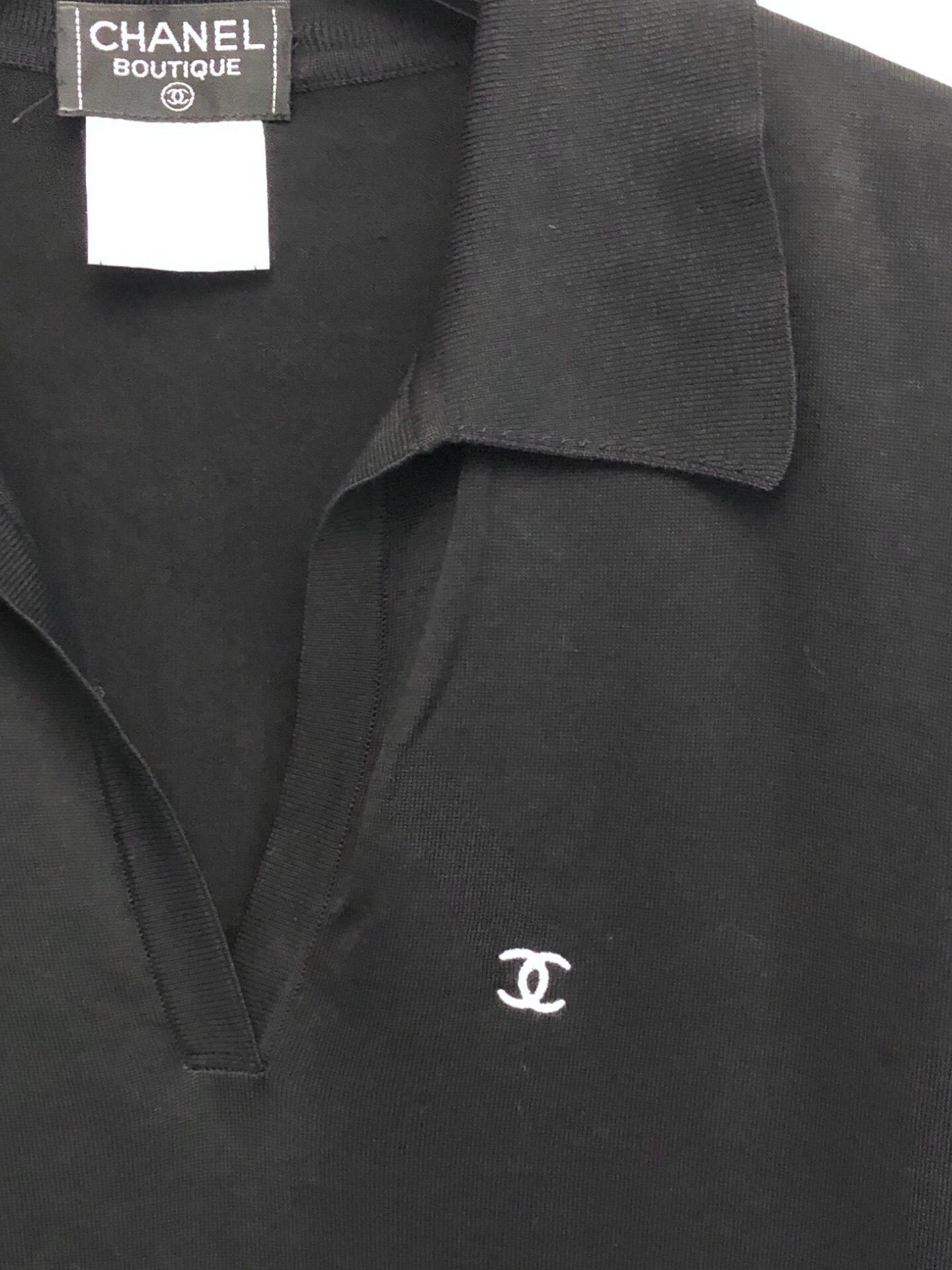 - Chanel black knitted collared pullover polo top from spring 1998 collection. This collared polo top is very versatile that can be worn by both women and men. You can never go wrong with a black classic polo top! 

- Featuring an embroidered white