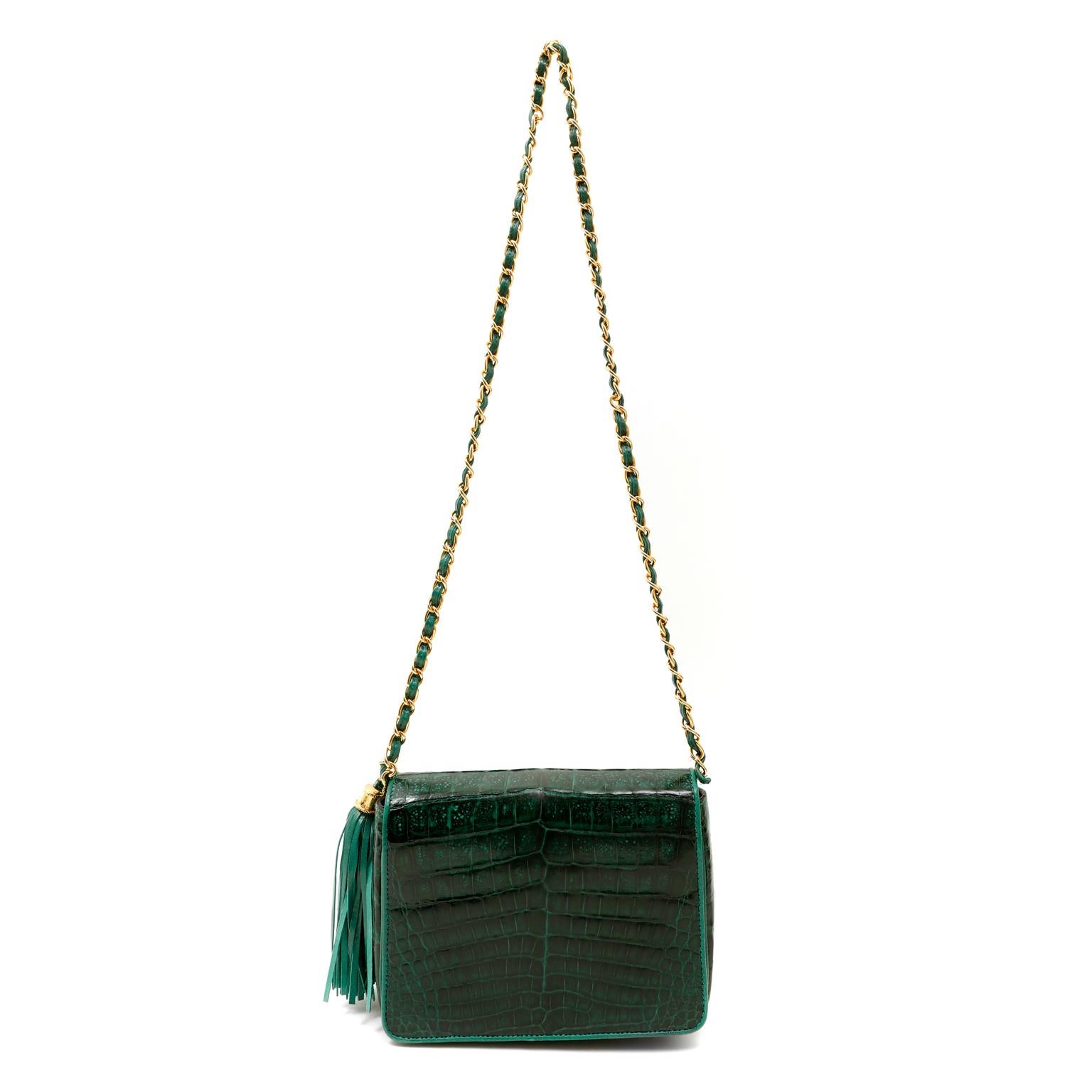 This authentic Chanel Emerald Green Crocodile Small Flap Bag is in excellent vintage condition.  A beautiful bag, this striking piece is also very collectible as Chanel is no longer producing exotics.  
Glorious emerald green niloticus crocodile