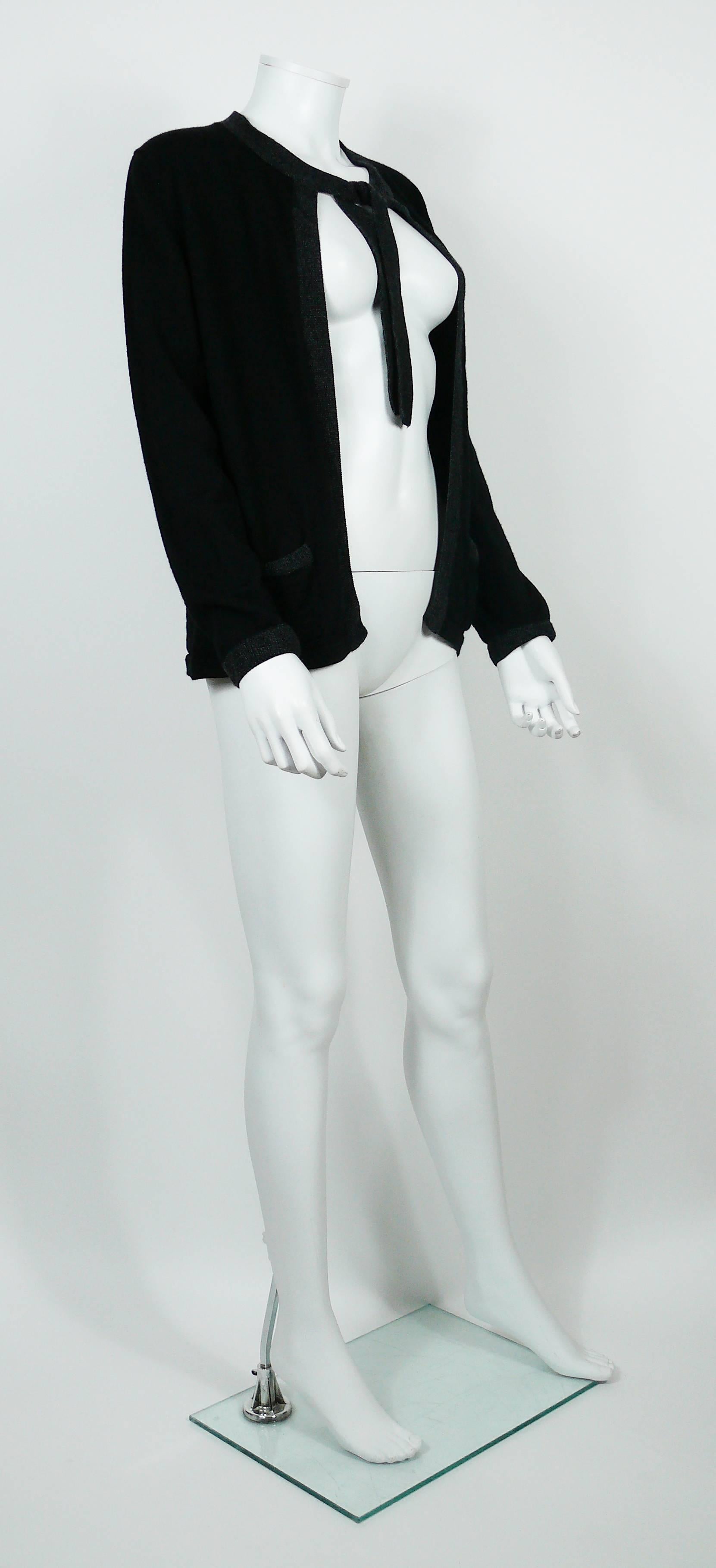 CHANEL Uniform black wool cardigan with grey trim and CC logo detail on left pocket.

Please note this item was original part of a CHANEL employee uniform.

Label reads CHANEL UNIFORM.
Made in China.

Size tag reads : M.
Please refer to